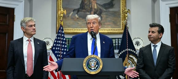 US President Donald Trump speaks alongside Medicare and Medicaid Administrator Mehmet Oz (L) and Food and Drug Administration (FDA) Commissioner Martin Makary (R) during a news conference about prescription drug prices, in the Roosevelt Room of the White House on May 12, 2025, in Washington, DC. (Photo by Jim WATSON / AFP)