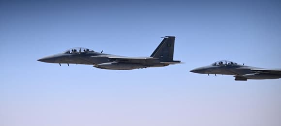 Saudi fighter jets escorts Air Force One into Riyadh on May 13, 2025. (Photo by Brendan SMIALOWSKI / AFP)