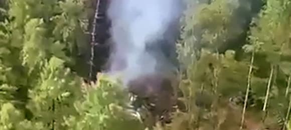 This video grab from a handout footage released by the Eastern Interregional Directorate for Transport of the Russian Investigative Committee on July 24, 2025, shows an aerial view of the crash site of the Antonov AN-24 passenger plane outside the town of Tynda in Russia's far eastern Amur region. A passenger plane carrying 49 people crashed in Russia's far eastern region of Amur on July 24, 2025, authorities said. (Photo by Handout / Investigative Committee of Russia / AFP) / RESTRICTED TO EDITORIAL USE - MANDATORY CREDIT 