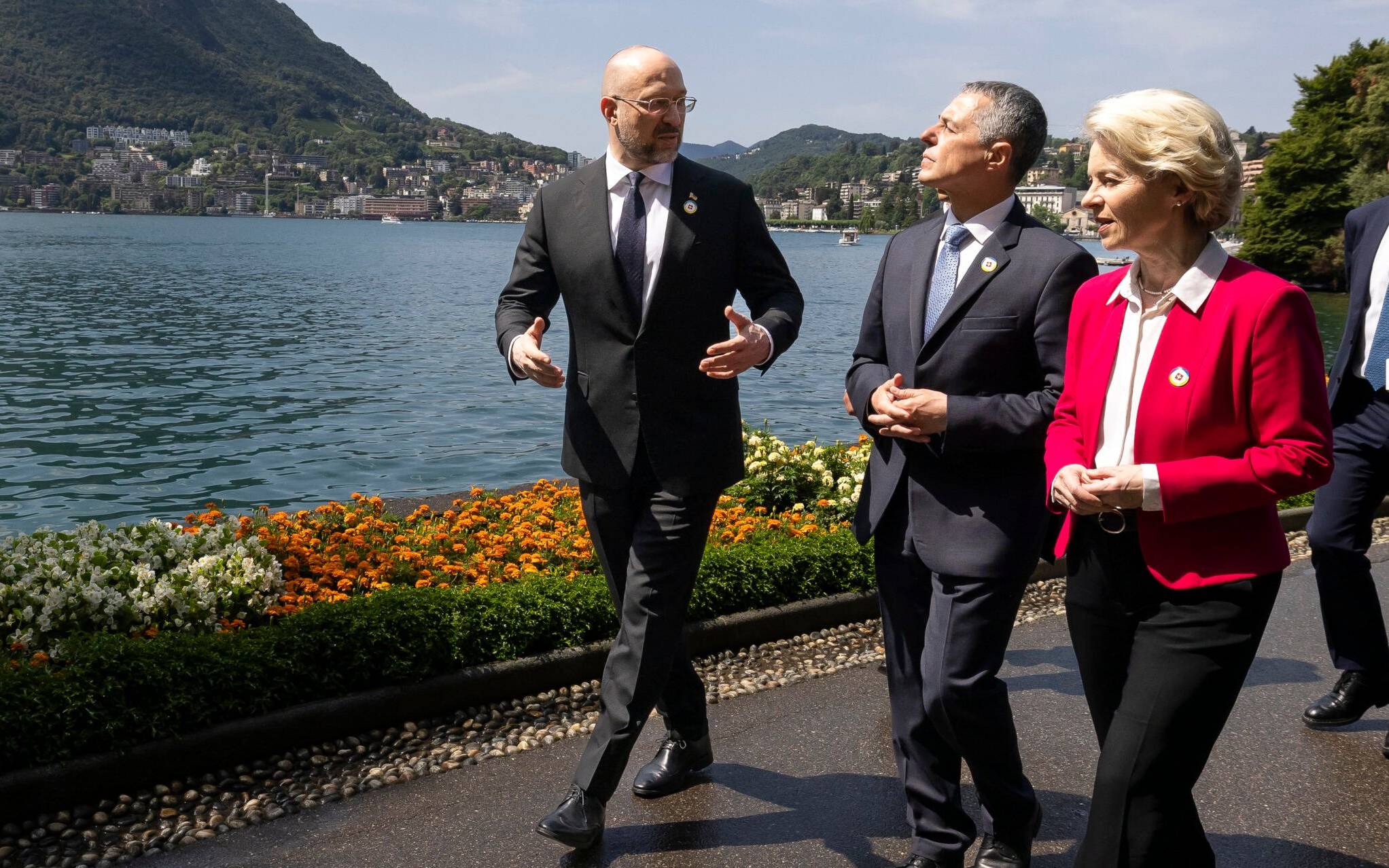 President of the Swiss Confederation Ignazio Cassis (2ndL), Ukrainian Prime Minister Denys Shmyhal (L) and Ursula von der Leyen, President of the European Commission talk before the start of the two-day Ukraine Recovery Conference in Lugano, Switzerland, on July 4, 2022. - Ministers from dozens of countries and international organisations leaders are expected to gather in the southern Swiss city of Lugano with the aim of providing a roadmap for the war-ravaged country's recovery. (Photo by MICHAEL BUHOLZER / POOL / AFP)