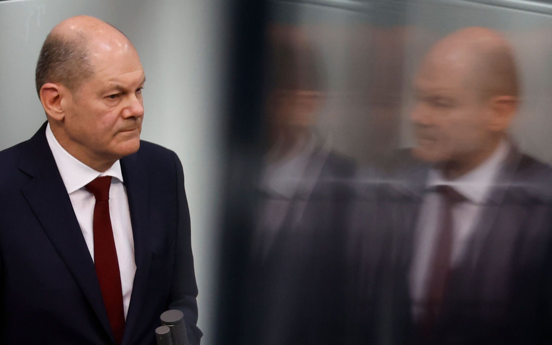 German Chancellor Olaf Scholz speaks during an extraordinary session of the Bundestag (lower house of parliament) on February 27, 2022 in Berlin. - Germany on February 26, 2022 dramatically ramped up its backing for Ukraine's battle against Russia, approving weapons deliveries for Kyiv in a policy U-turn and agreeing to limit Moscow's access to the SWIFT interbank system. In a shift from its longstanding policy of banning weapons exports to conflict zones, Berlin is opening up its Bundeswehr store, pledging to transfer 1,000 anti-tank weapons and 500 "Stinger" class surface-to-air missiles to Ukraine. (Photo by Odd ANDERSEN / AFP)