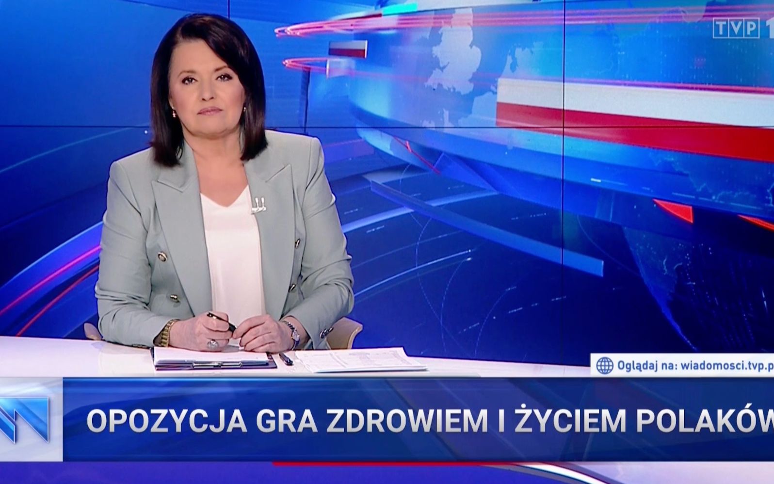 Grafika do artykułu Wiadomości TVP: Rząd  walczy z wirusem o nasze życie, a opozycja naraża nas na śmierć
