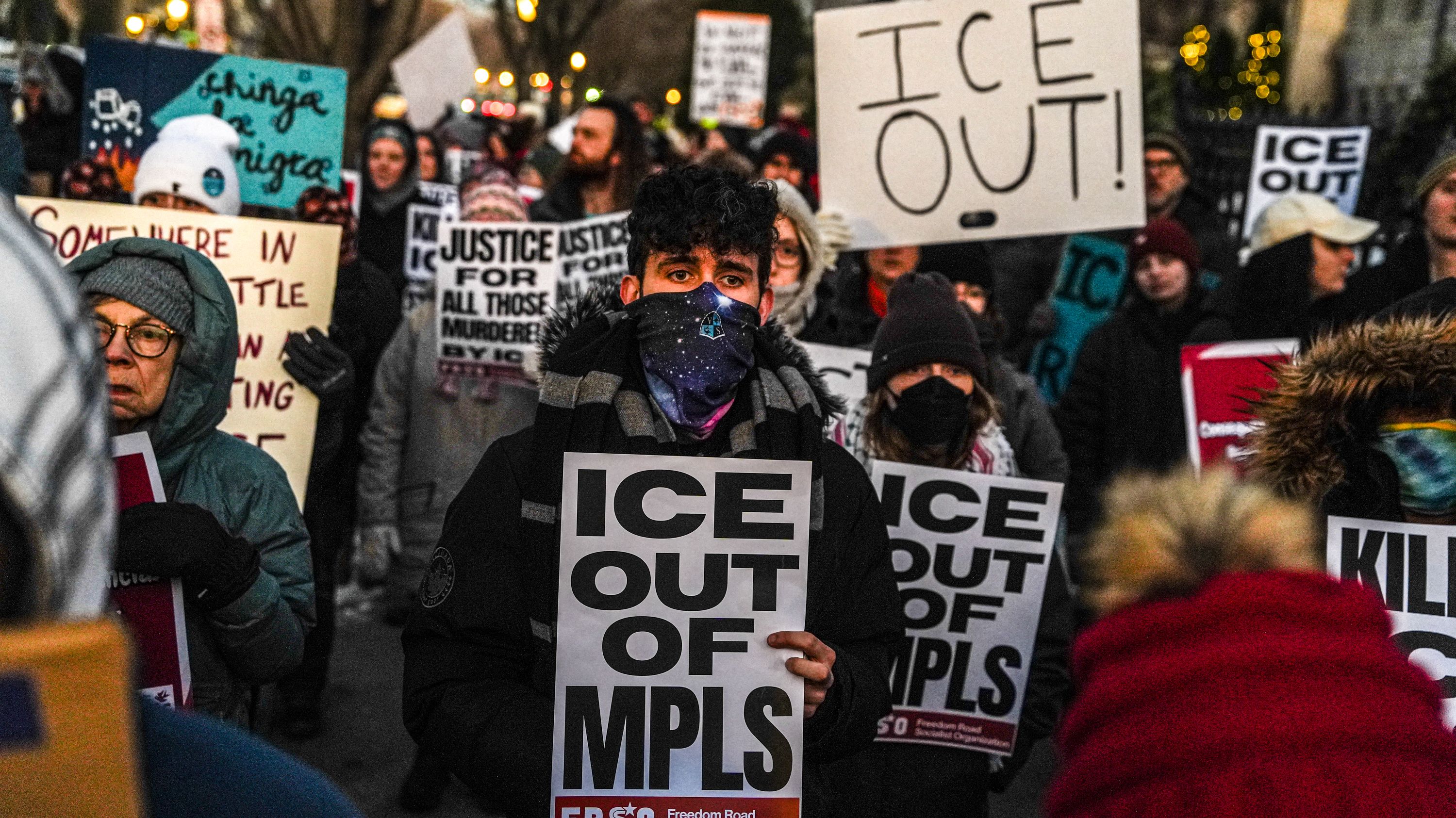 People participate in an anti-ICE protest outside of the Governors Residence, Friday, Feb. 6, 2026, in St. Paul, Minn. (AP Photo/Ryan Murphy)