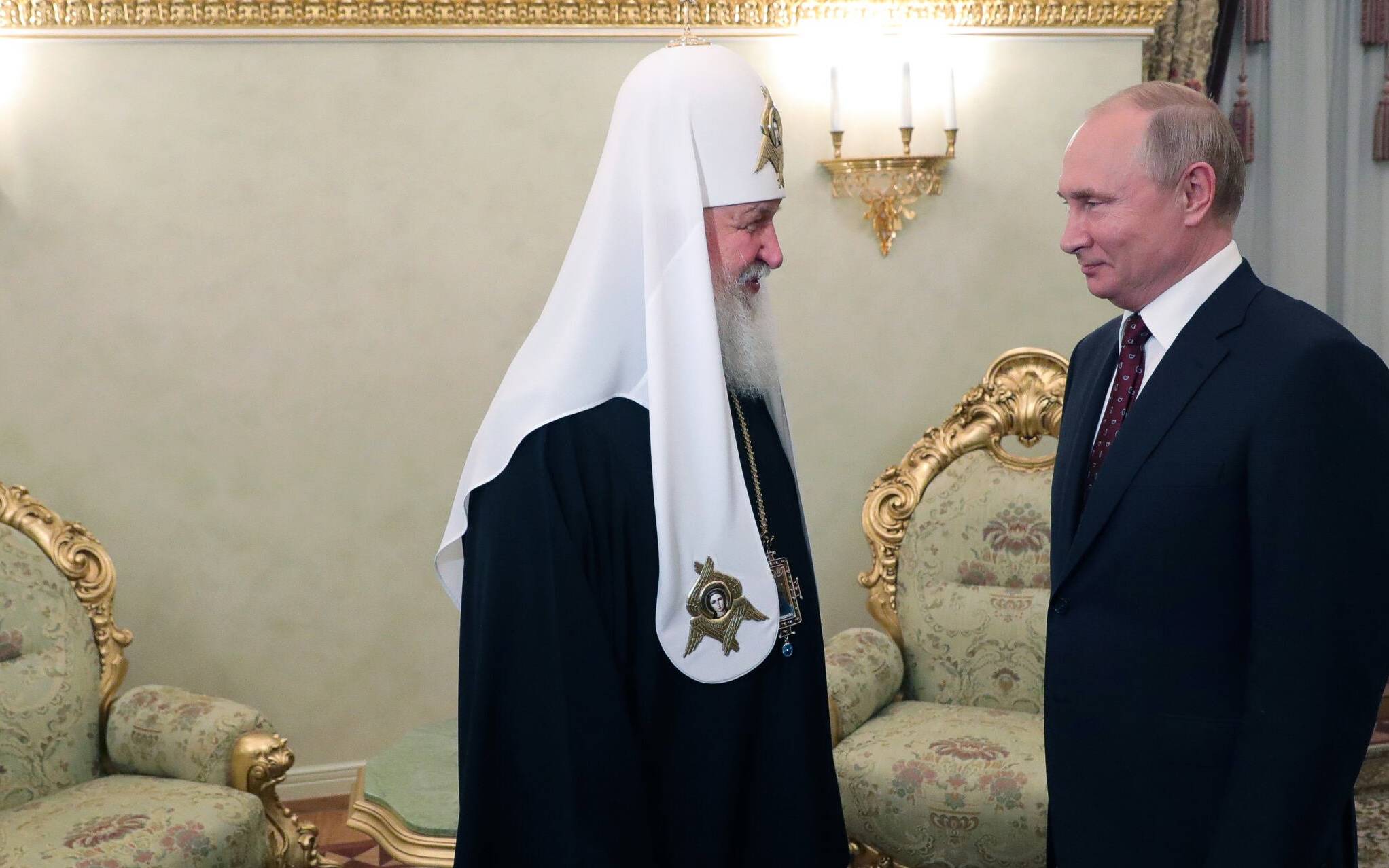 Russian President Vladimir Putin (R) meets with Patriarch Kirill, the head of the Russian Orthodox Church, to commemorate the day of Saints Cyril and Methodius, evangelisers of the Slavs, at the Kremlin in Moscow on May 24, 2019. (Photo by Mikhael Klimentyev / Sputnik / AFP)