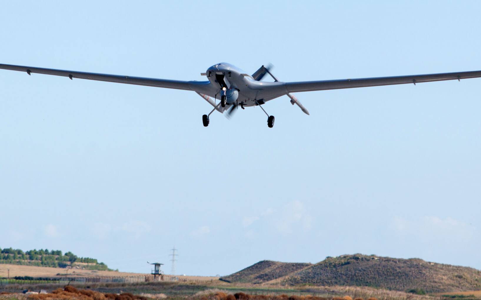 The Bayraktar TB2 drone is pictured flying on December 16, 2019 at Gecitkale military airbase near Famagusta in the self-proclaimed Turkish Republic of Northern Cyprus (TRNC). - The Turkish military drone was delivered to northern Cyprus amid growing tensions over Turkey's deal with Libya that extended its claims to the gas-rich eastern Mediterranean. The Bayraktar TB2 drone landed in Gecitkale Airport in Famagusta around 0700 GMT, an AFP correspondent said, after the breakaway northern Cyprus government approved the use of the airport for unmanned aerial vehicles. It followed a deal signed last month between Libya and Turkey that could prove crucial in the scramble for recently discovered gas reserves in the eastern Mediterranean. (Photo by Birol BEBEK / AFP)