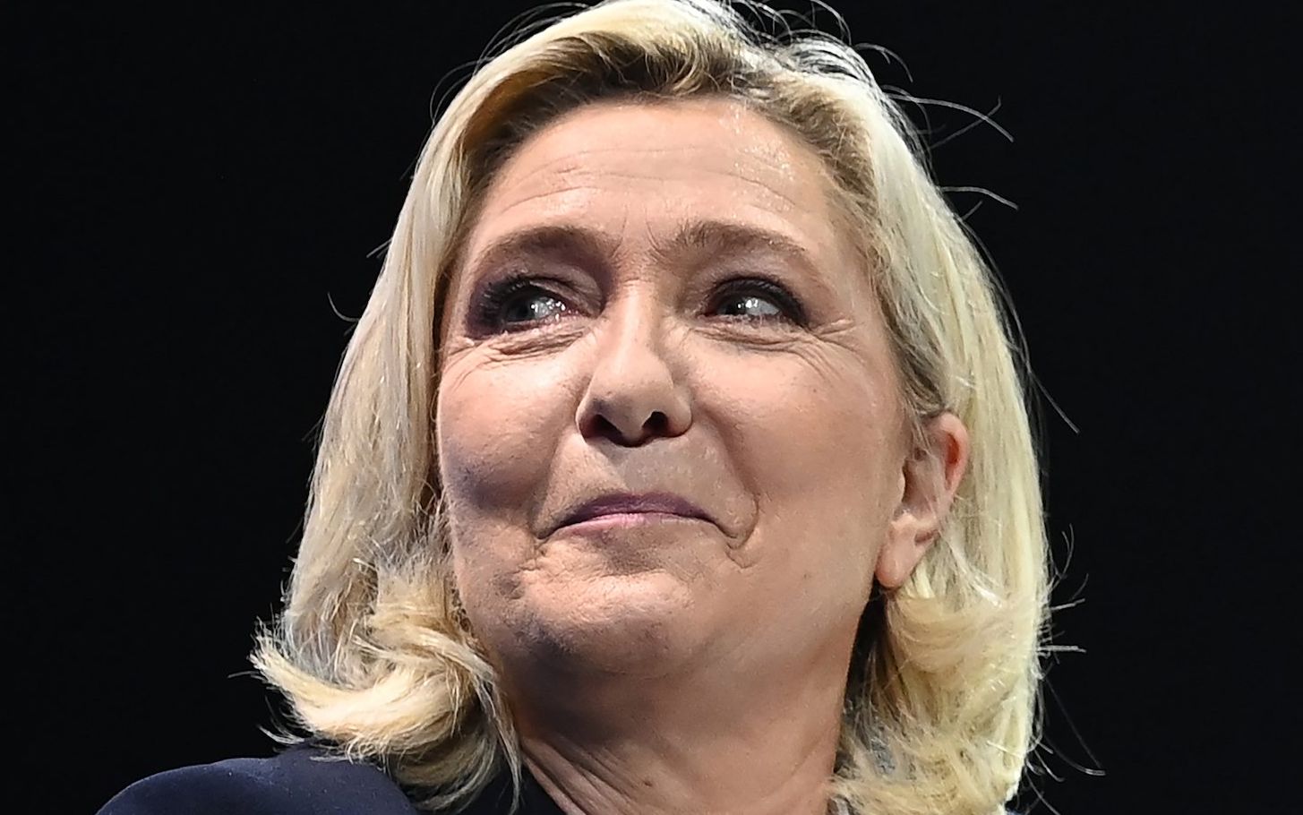 French far-right Rassemblement National (RN) party Member of Parliament and presidential candidate Marine Le Pen speaks during a campaign rally in Perpignan, southern France, on April 7, 2022. - French voters head to the polls on April 10 and 24 for a two-round pesidential election. (Photo by LIONEL BONAVENTURE / AFP)