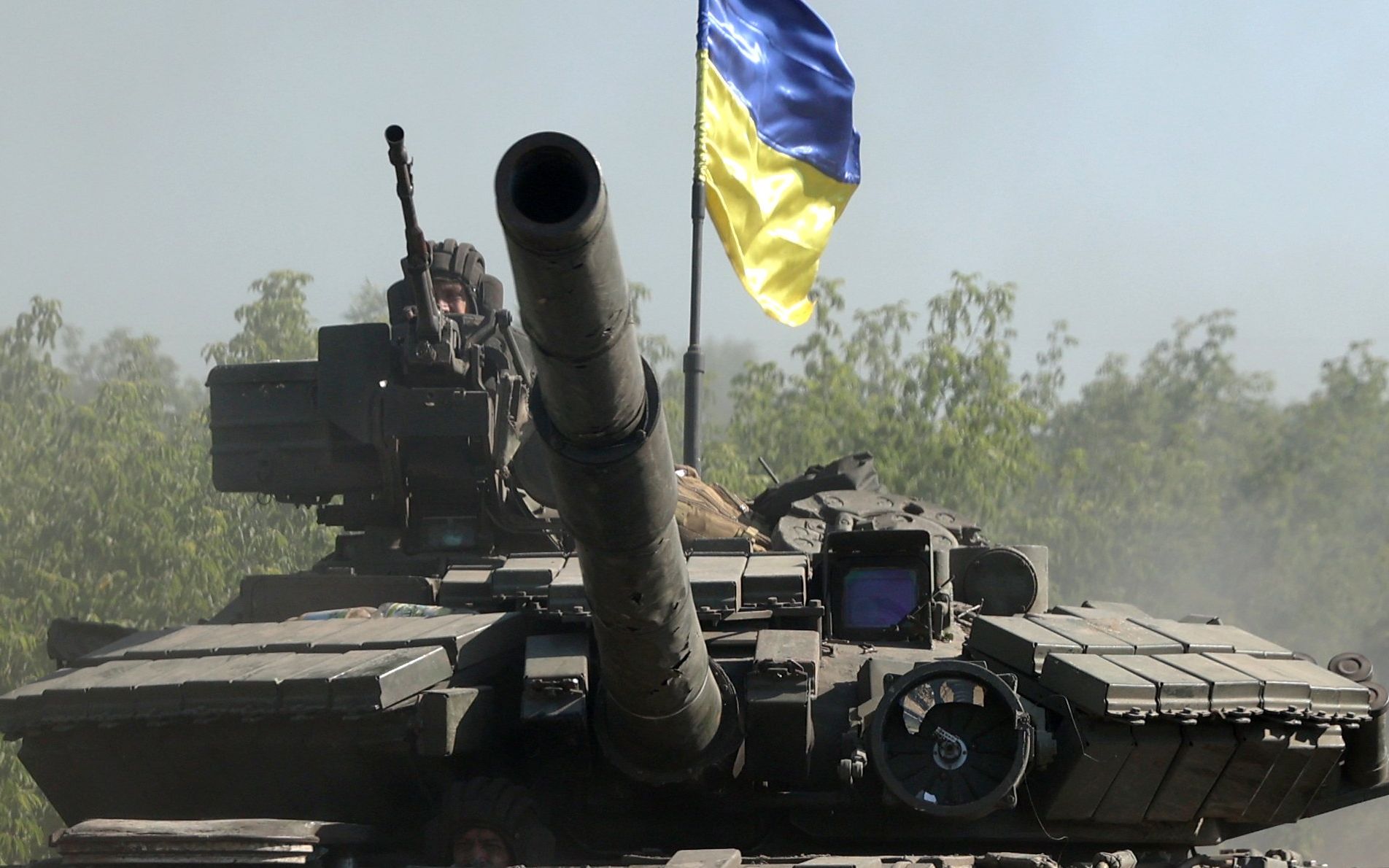 Ukrainian troop ride a tank on a road of the eastern Ukrainian region of Donbas on June 21, 2022, as Ukraine says Russian shelling has caused "catastrophic destruction" in the eastern industrial city of Lysychansk, which lies just across a river from Severodonetsk where Russian and Ukrainian troops have been locked in battle for weeks. - Regional governor Sergiy Gaiday says that non-stop shelling of Lysychansk on June 20 destroyed 10 residential blocks and a police station, killing at least one person. (Photo by Anatolii Stepanov / AFP)