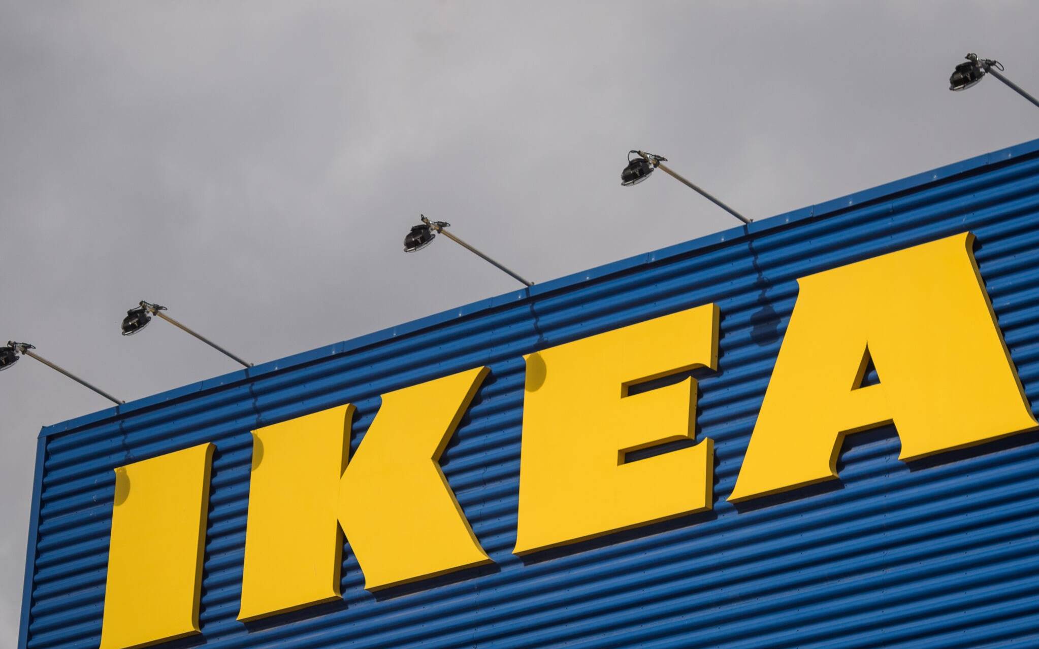 (FILES) In this file photo taken on March 30, 2016 the logo of IKEA is pictured outside Europe's biggest Ikea store in Kungens Kurva, south-west of Stockholm on March 30, 2016. - Swedish furniture giant Ikea said on March 3, 2022 it would suspend its activities in Russia and Belarus, affecting nearly 15,000 employees, 17 stores and three production sites, in response to the war in Ukraine. (Photo by JONATHAN NACKSTRAND / AFP)