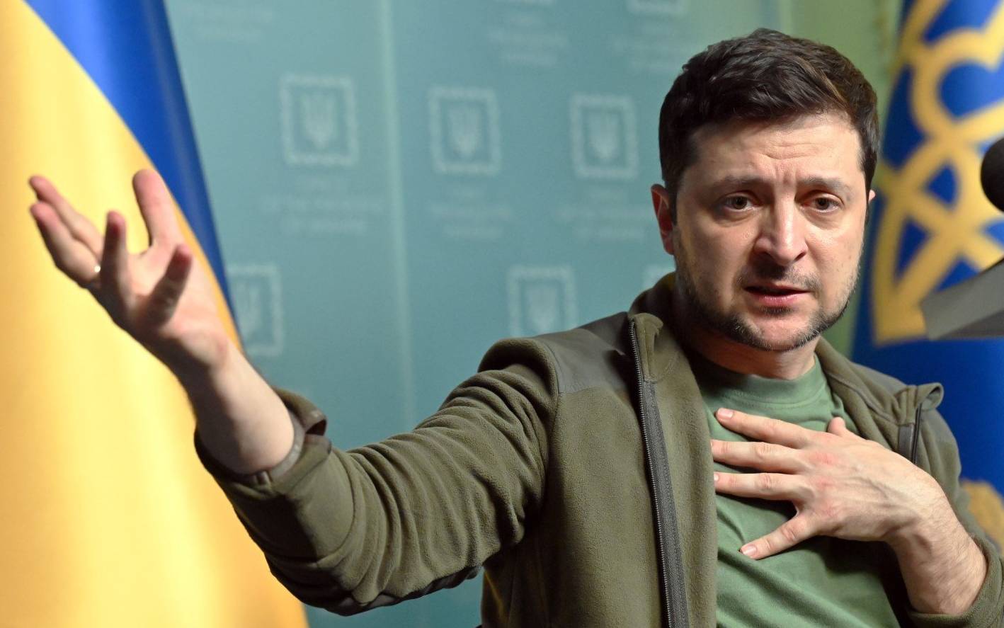 Ukrainian President Volodymyr Zelensky gestures as he speaks during a press conference in Kyiv on March 3, 2022. - Ukraine President Volodymyr Zelensky called on the West on March 3, 2022, to increase military aid to Ukraine, saying Russia would advance on the rest of Europe otherwise. "If you do not have the power to close the skies, then give me planes!" Zelensky said at a press conference. "If we are no more then, God forbid, Latvia, Lithuania, Estonia will be next," he said, adding: "Believe me." (Photo by Sergei SUPINSKY / AFP)