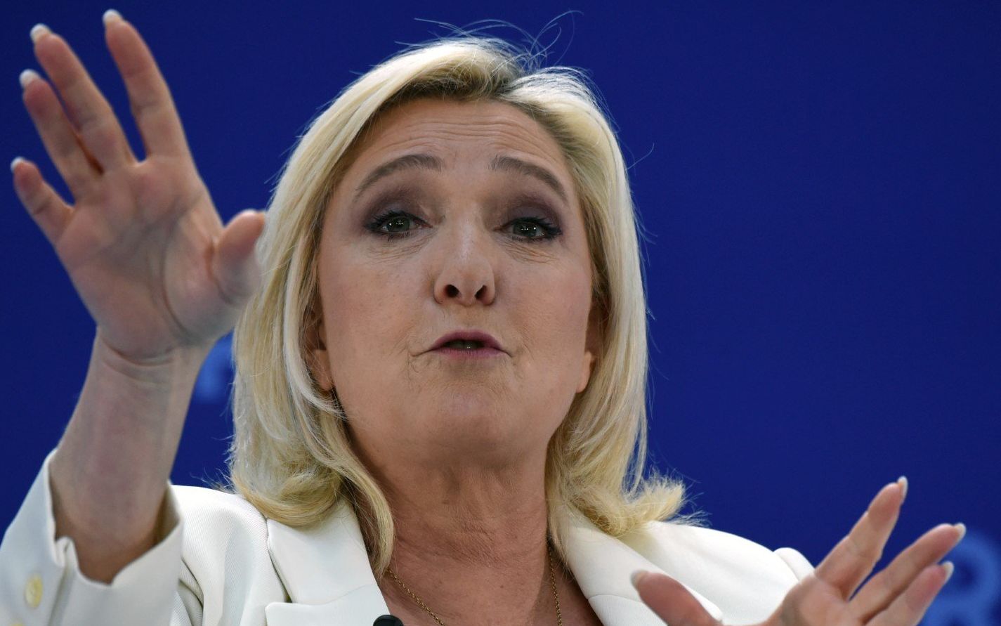 French far-right Rassemblement National (RN) party presidential candidate Marine Le Pen speaks as she presents her economic campaign program to the French employers' association Medef in Paris on February 21, 2022. (Photo by Eric PIERMONT / AFP)