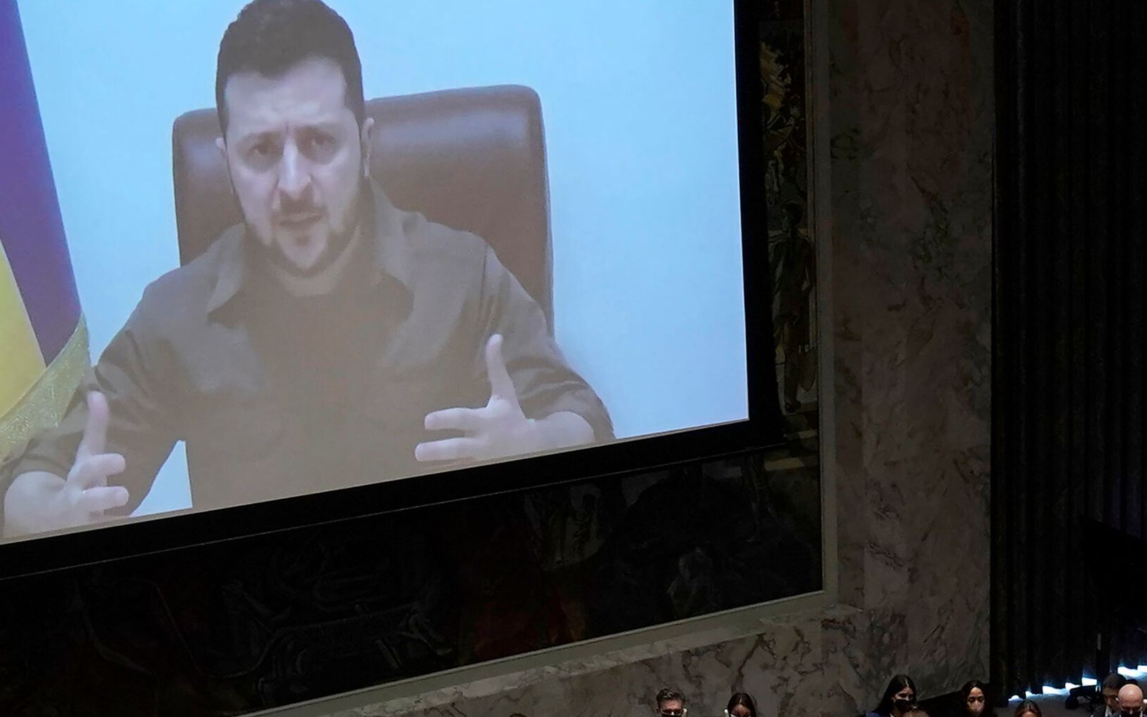 President Volodymyr Zelensky, of Ukraine, addresses a meeting of the United Nations Security Council in New York City on April 5, 2022. - Zelensky challenged the United Nations to "act immediately" or "dissolve yourself altogether" during a blistering address in which he showed a harrowing video of dead bodies -- including children -- he said were victims of Russian atrocities. (Photo by TIMOTHY A. CLARY / AFP)