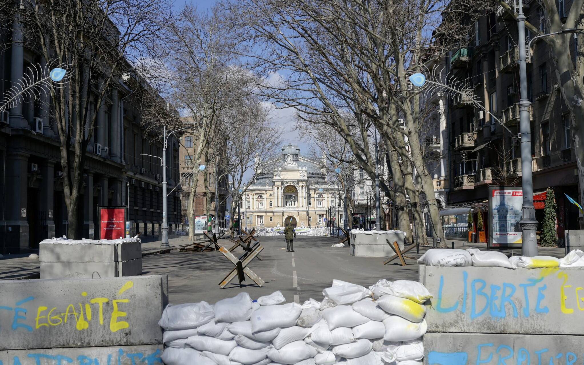 Concrete blocks with French national motto "liberty, equality, fraternity" written on it 
form a barricade in front of the National Academic Theater of Opera and Ballet in Odessa on March 17, 2022. - Odessa, which Ukraine fears could be the next target of Russia's offensive in the south, is the country's main port and is vital for its economy. But the city of one million people close to the Romanian and Moldovan borders also holds a special place in the Russian imagination. (Photo by BULENT KILIC / AFP)