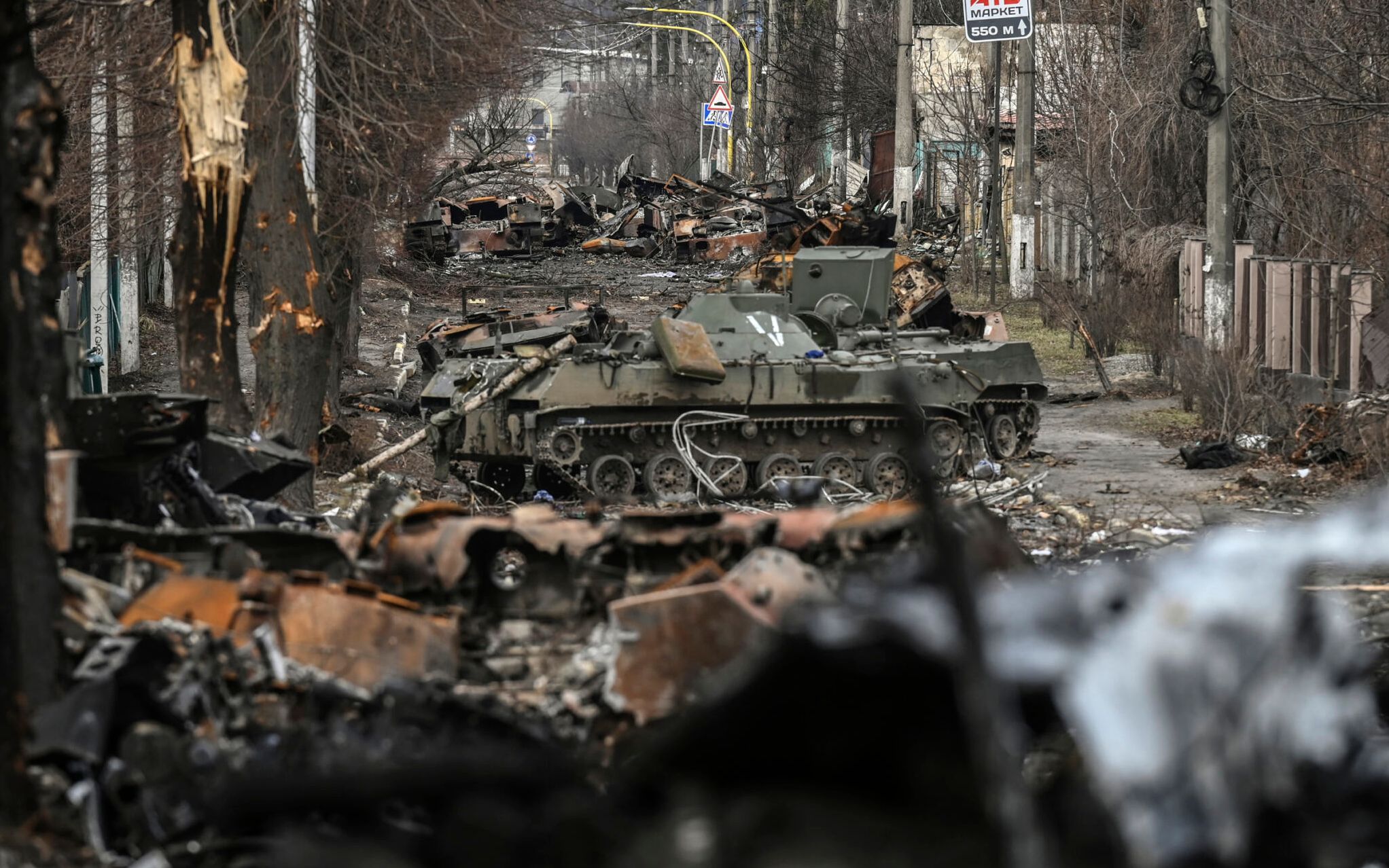 This general view shows destroyed Russian armored vehicles in the city of Bucha, west of Kyiv, on March 4, 2022. - The UN Human Rights Council on March 4, 2022, overwhelmingly voted to create a top-level investigation into violations committed following Russia's invasion of Ukraine. More than 1.2 million people have fled Ukraine into neighbouring countries since Russia launched its full-scale invasion on February 24, United Nations figures showed on March 4, 2022. (Photo by ARIS MESSINIS / AFP)