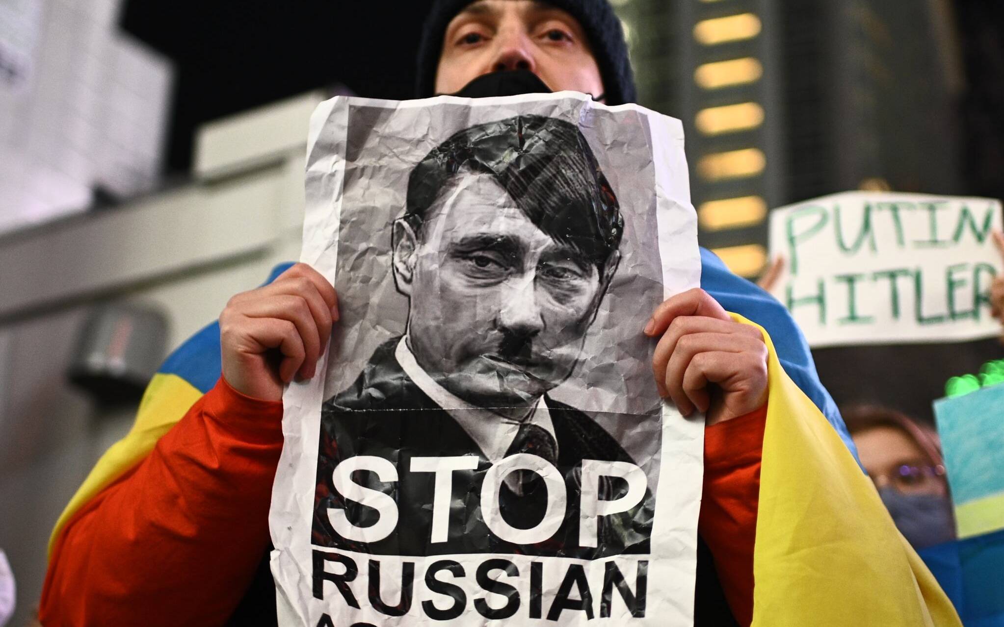 A man takes part in a protest against Russia's actions in Ukraine during a rally at Shibuya district in Tokyo on February 24, 2022. (Photo by Philip FONG / AFP)