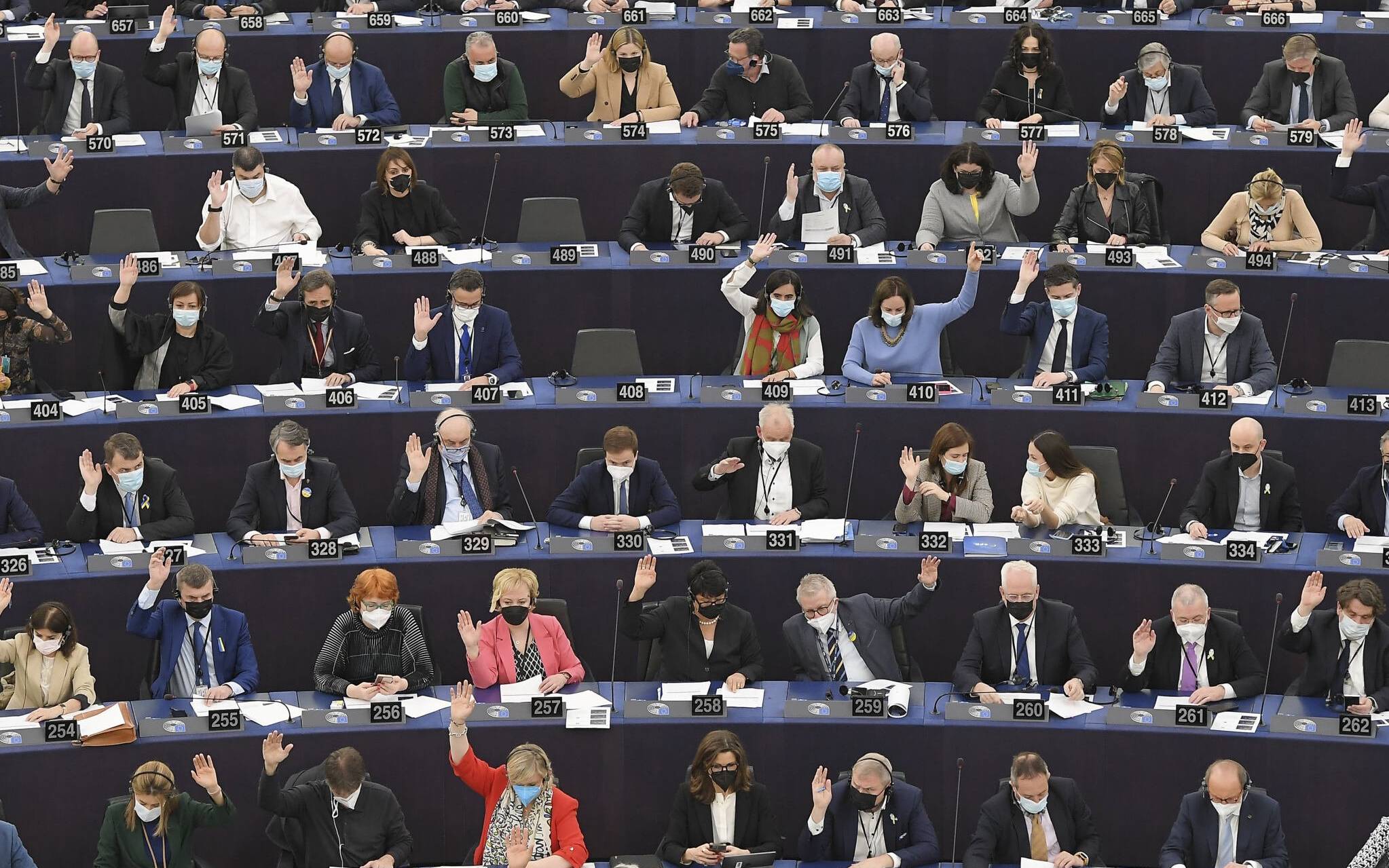 Members of the European Parliament take part in a voting session during a plenary session at the European Parliament in Strasbourg, eastern France, on April 5, 2022. (Photo by Frederick FLORIN / AFP)