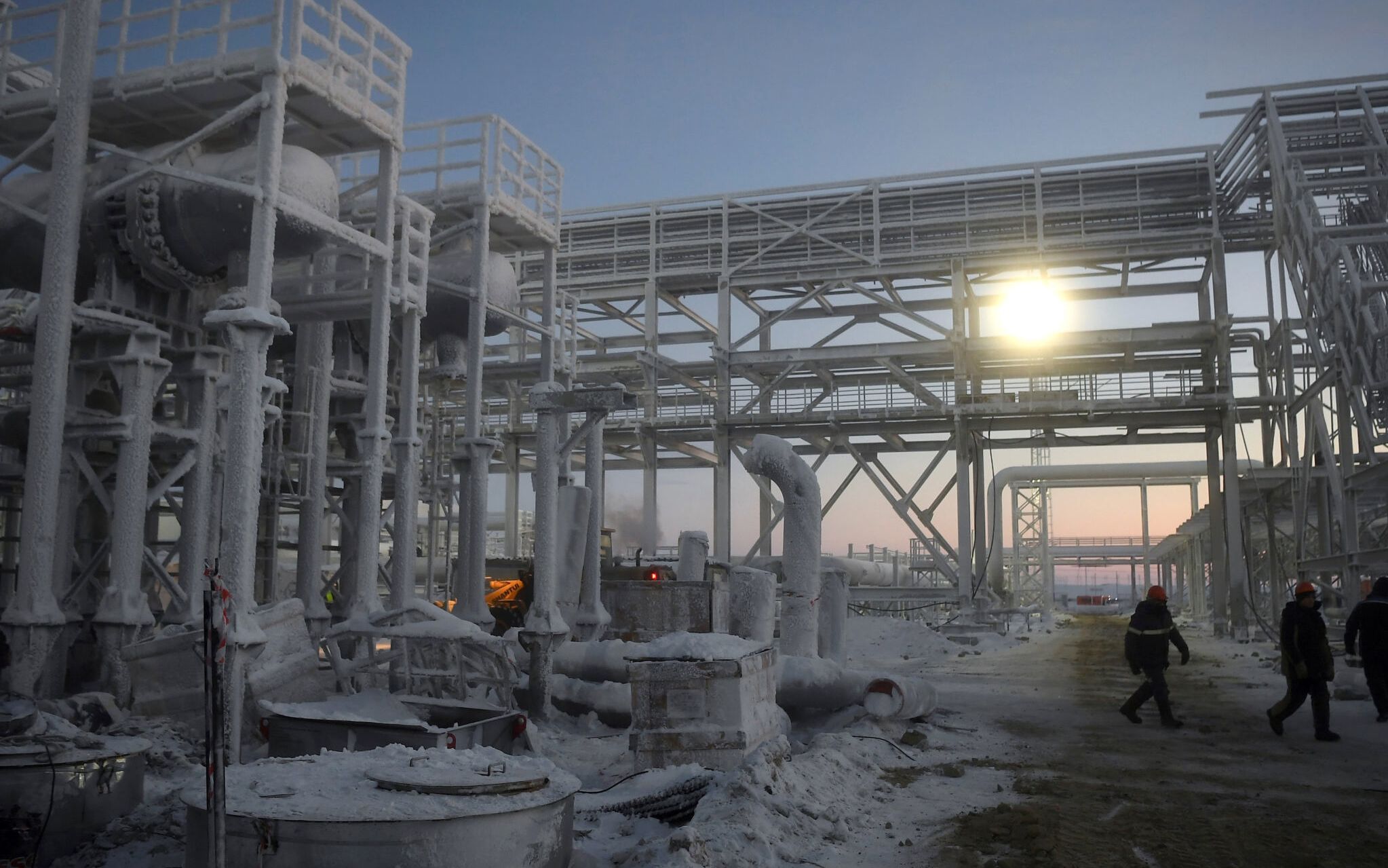 A photograph shows the Utrenneye field, the resource base for Novatek's Arctic LNG 2 project, located in the Gydan Peninsula on the Kara Sea shore line in the Arctic circle, some 2500 km from Moscow on November 30, 2021. - As part of the The Arctic LNG 2 mega-project gravity-based structures (GBS) a platform is being constructed in Belokamenka near Murmansk. The 450-tonne platform will house liquefied natural gas (LNG) production in the Gydan Peninsula in the western Siberia region of Russia. Once construction is complete, the concrete structures will be flooded. The platform will float up and be towed to the Utrenneye gas field. The construction the structure is part of a new LNG project for Novatek, the largest natural gas producer in Russia. This platform aims to be completed by August 2022. (Photo by Natalia KOLESNIKOVA / AFP)