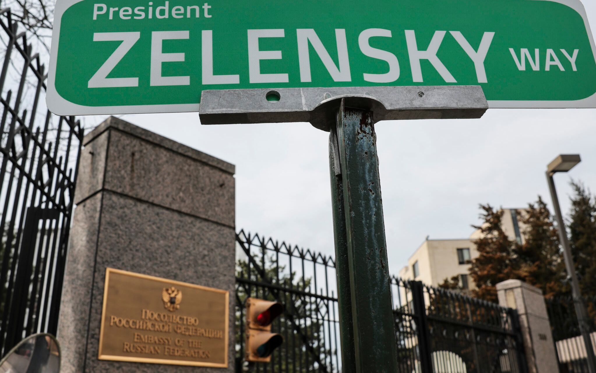 WASHINGTON, DC - MARCH 07: Pro-Ukraine protesters place a sign in support of Ukrainian President Zelensky outside of the Embassy of the Russian Federation on March 07, 2022 in Washington, DC. The group of protesters is demonstrating against Russia's invasion of Ukraine.   Kevin Dietsch/Getty Images/AFP (Photo by Kevin Dietsch / GETTY IMAGES NORTH AMERICA / Getty Images via AFP)