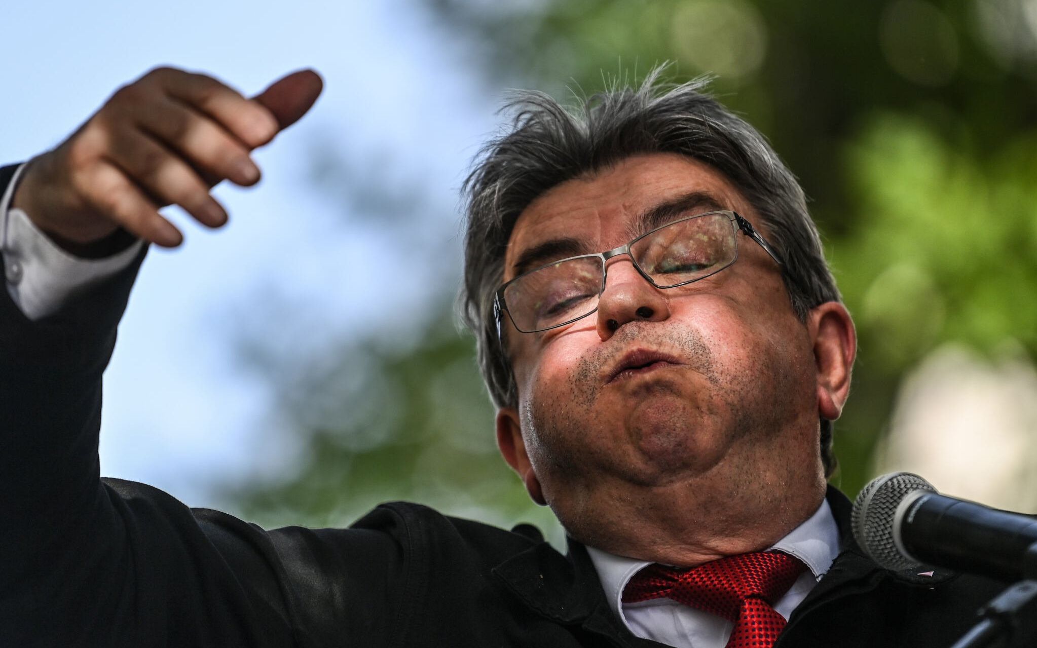 French leftist La France Insoumise (LFI) party leader, Member of Parliament and leader of left-wing coalition NUPES (Nouvelle Union Populaire Ecologique et Sociale - New People's Ecologic and Social Union) Jean-Luc Melenchon delivers a speech during a campaign visit in support of the local constituency's candidate in Villeurbanne, central-eastern France, on June 4, 2022, ahead of France's parliamentary elections. - French voter head to the polls on June 12 and 19 for legislative elections. (Photo by OLIVIER CHASSIGNOLE / AFP)
