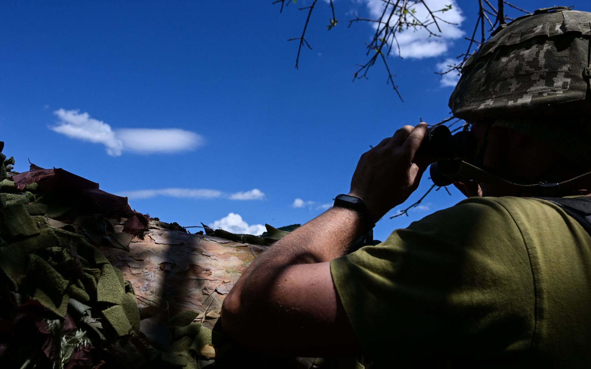 Ukrainian soldier is pictured in a trench near the front line in eastern Ukraine, on July 13, 2022, amid the Russian invasion of Ukraine. (Photo by MIGUEL MEDINA / AFP)