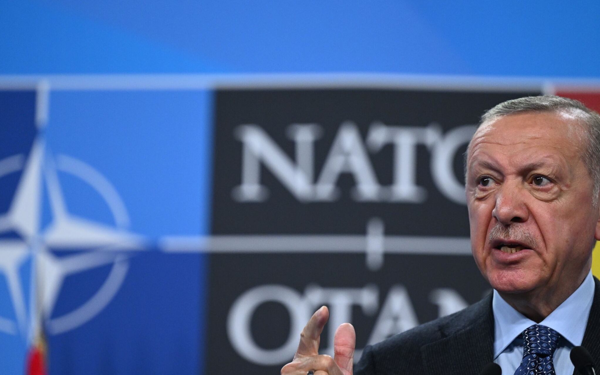 Turkey's President Recep Tayyip Erdogan addresses media representatives during a press conference at the NATO summit at the Ifema congress centre in Madrid, on June 30, 2022. (Photo by GABRIEL BOUYS / AFP)
