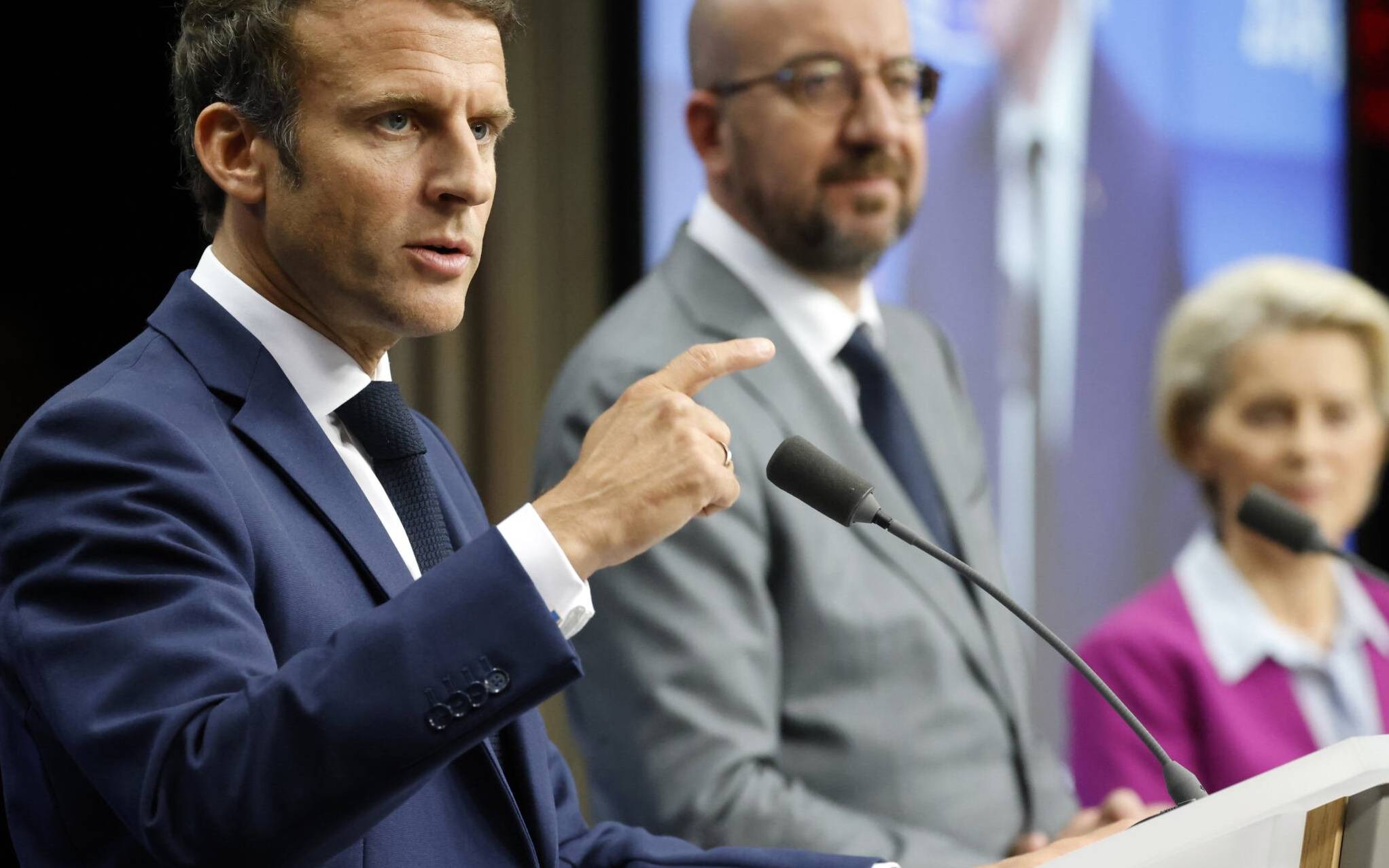 France's President Emmanuel Macron (L) gives a press conference with President of the European Council Charles Michel (C) and President of the European Commission Ursula von der Leyen at The European Council Building in Brussels on June 24, 2022. (Photo by Ludovic MARIN / AFP)