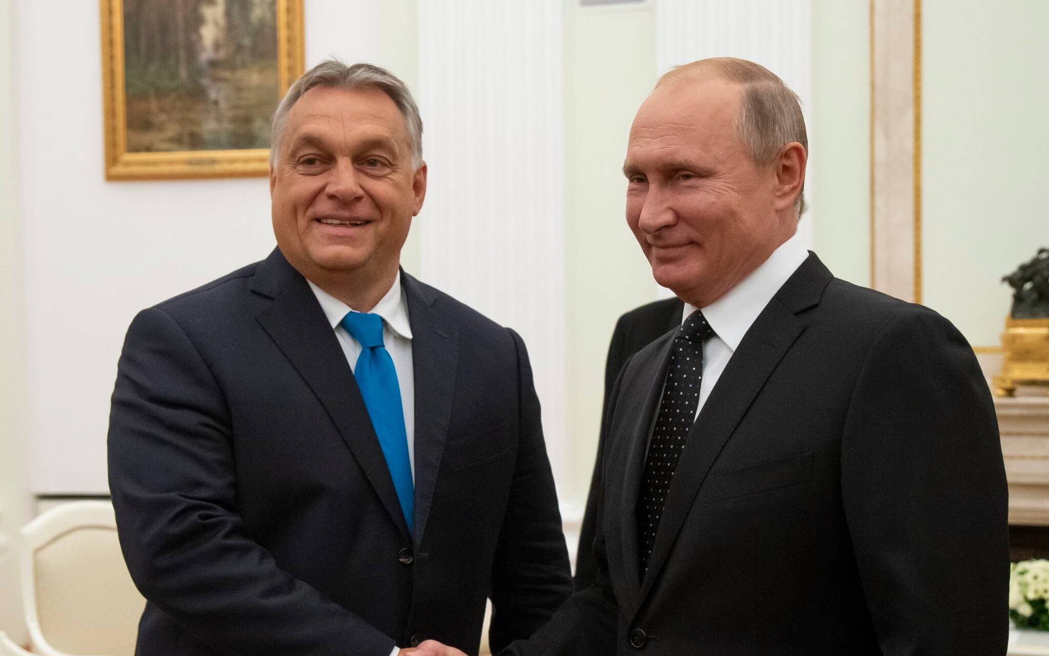 Hungarian Prime Minister Viktor Orban (L) shakes hands with Russian President Vladimir Putin during their meeting in the Kremlin in Moscow, on September 18, 2018. (Photo by Alexander Zemlianichenko / POOL / AFP)