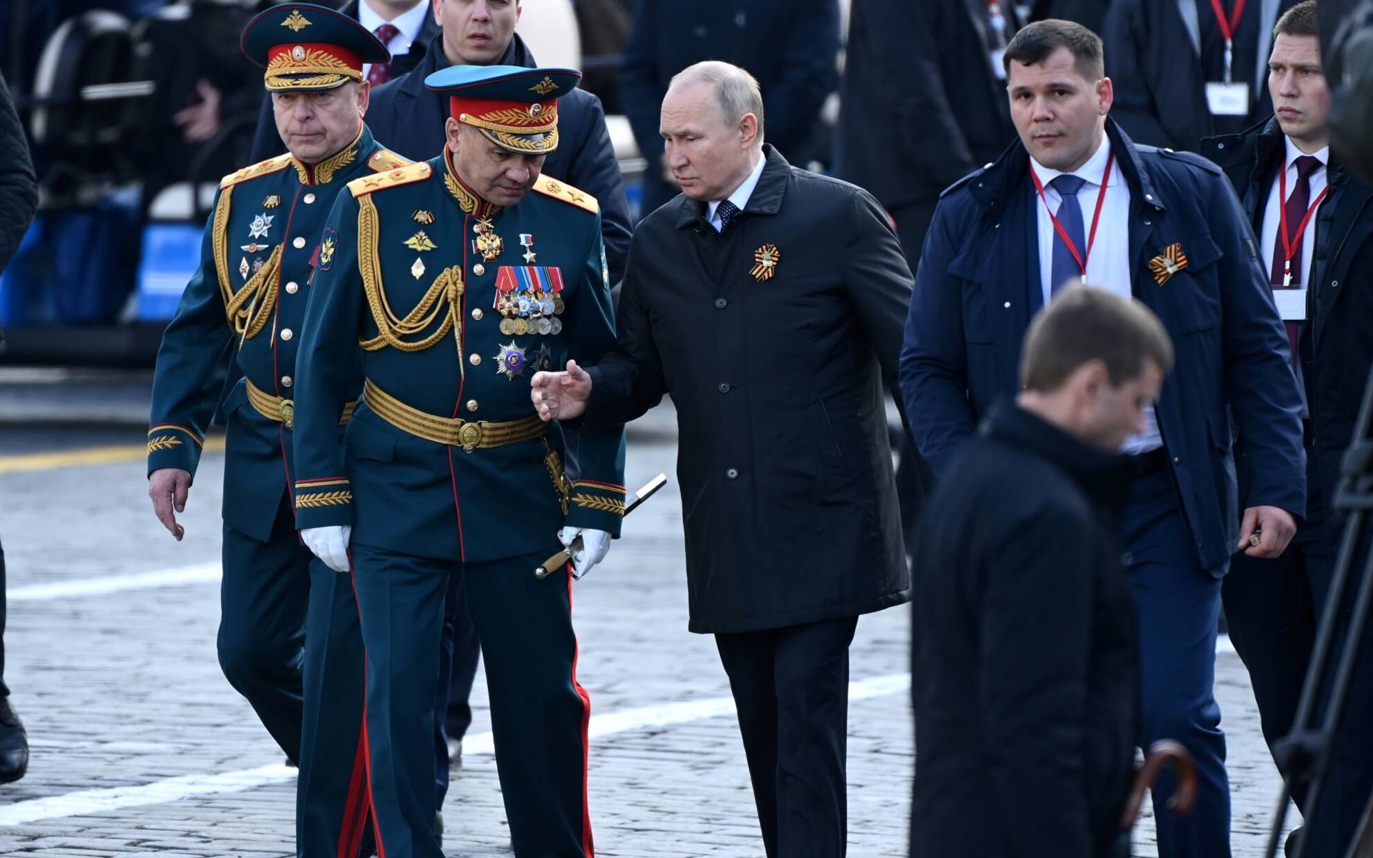 Russian President Vladimir Putin and Defence Minister Sergei Shoigu leave Red Square after the Victory Day military parade in central Moscow on May 9, 2022. - Russia celebrates the 77th anniversary of the victory over Nazi Germany during World War II. (Photo by Kirill KUDRYAVTSEV / AFP)