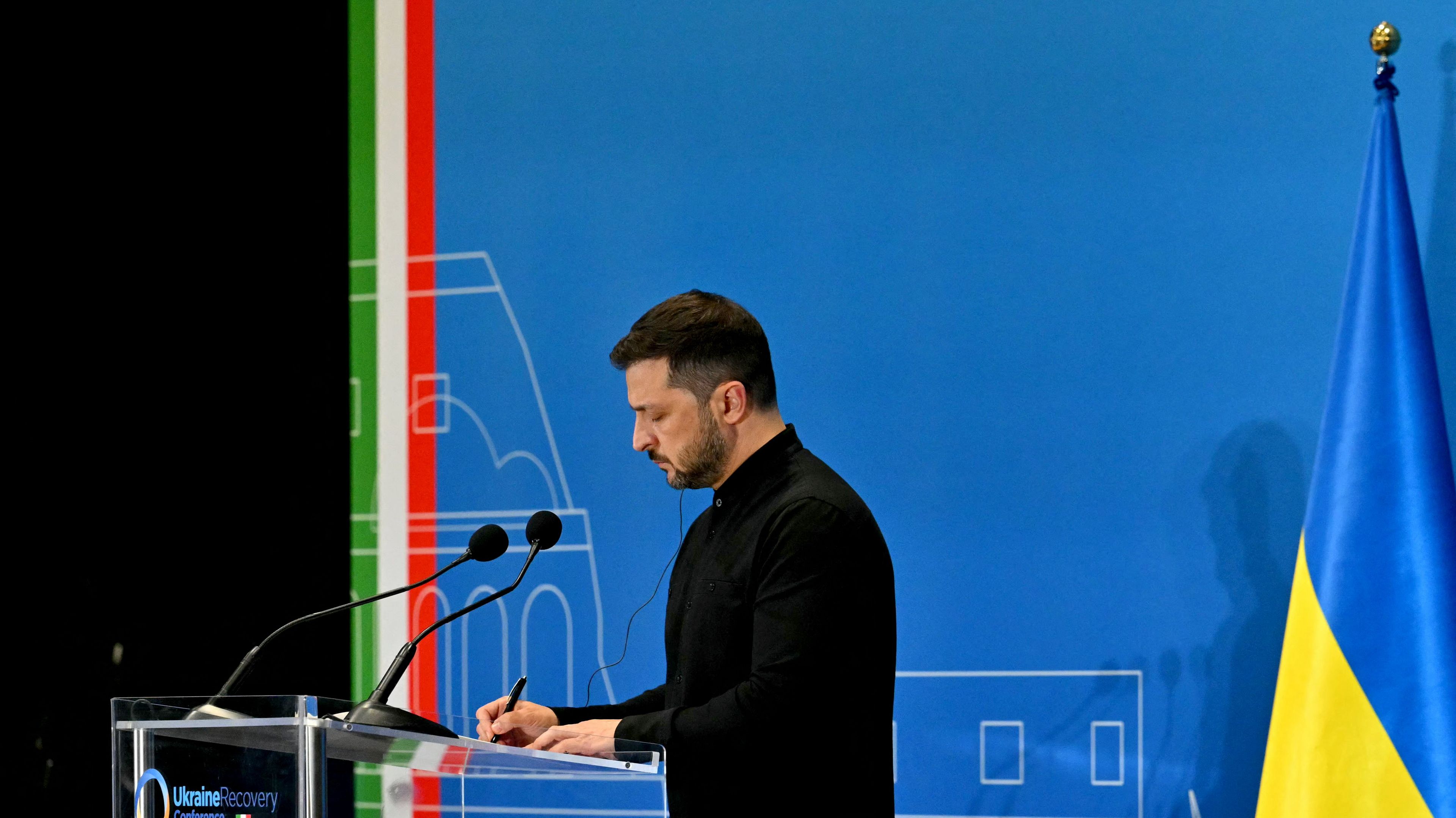 Ukraine's President Volodymyr Zelensky addresses a press conference during The Ukraine Recovery Conference 2025 (URC2025) at The Roma Convention Centre in Rome on July 10, 2025. The meeting of international leaders is aimed at mobilising support -- including private investment -- for the reconstruction of Ukraine, even as Russia steps up its attacks. (Photo by Andreas SOLARO / AFP)