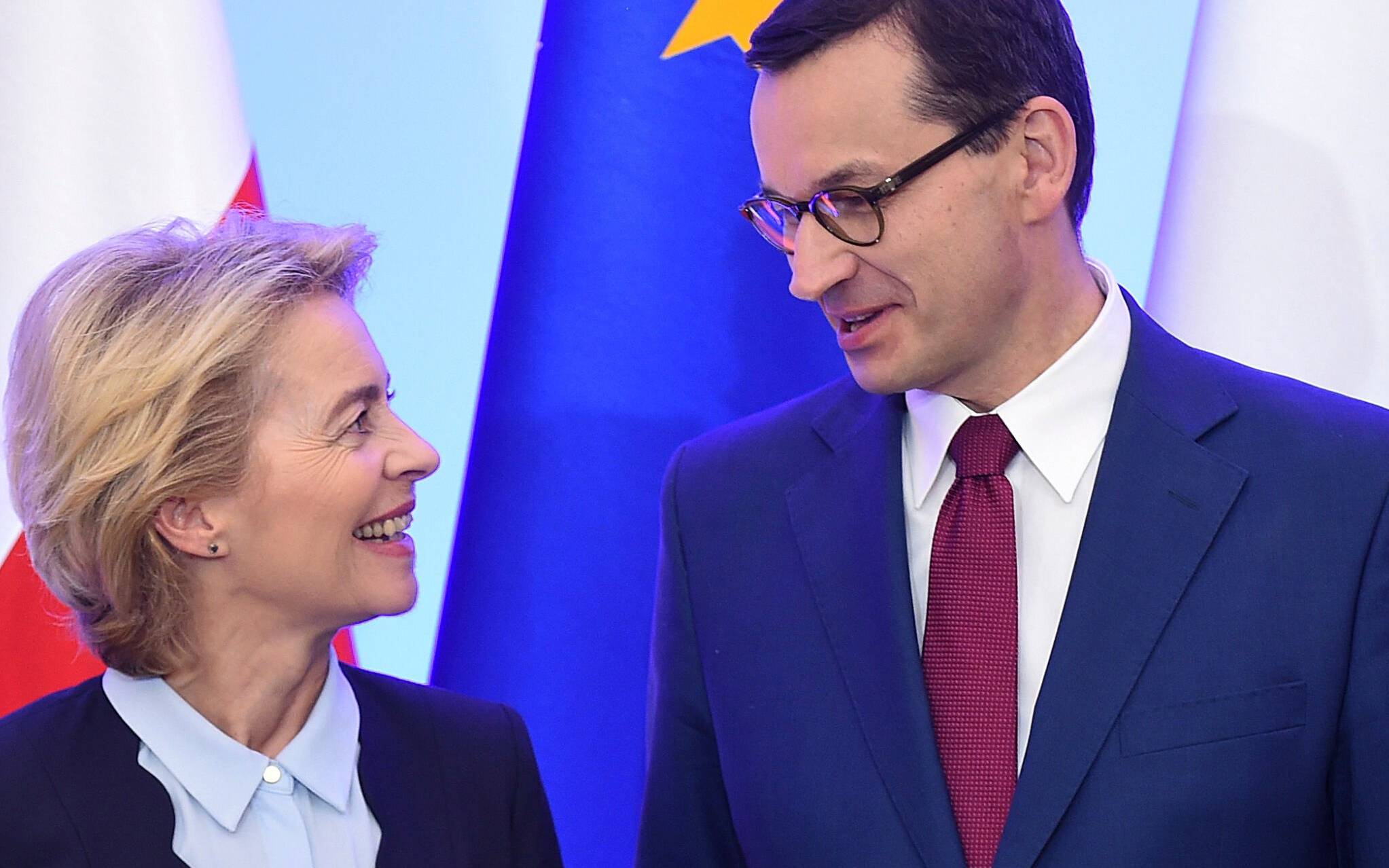 European Commission Chief Ursula Von der Leyen and Polish Prime Minister Mateusz Morawiecki share a smile during a meeting in Warsaw on July 25, 2019. (Photo by Janek SKARZYNSKI / AFP)