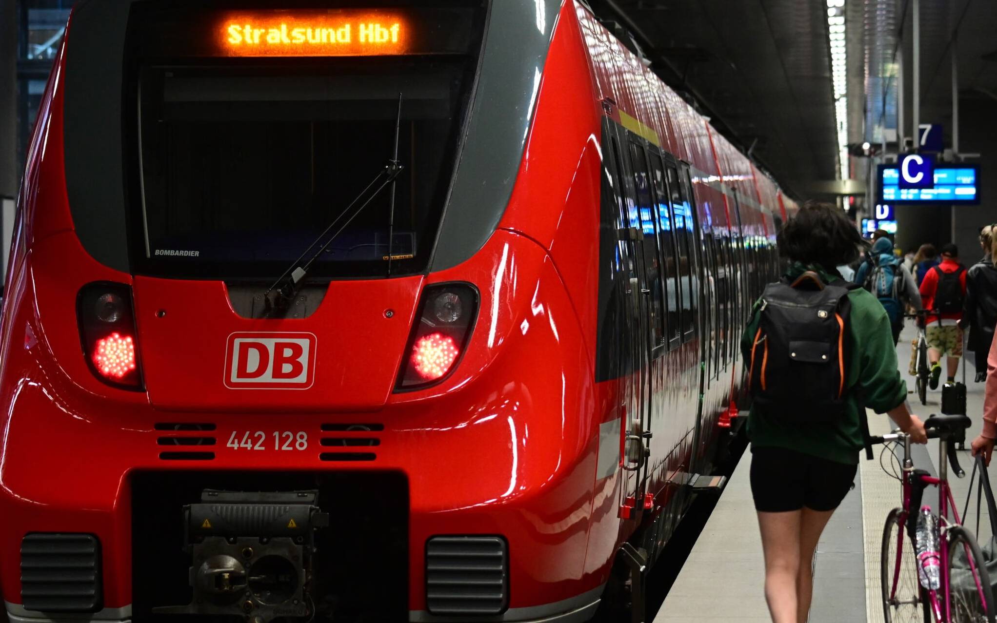 Travellers board a regional train to the northeastern Germany city of Stralsund at Berlin Central Station (Hauptbahnhof) in Berlin on June 4, 2022. - On June 1, 2022, commuters began paying just nine euros (USD 9.60) a month for public transport as an inflation-relief measure in Europe's biggest economy. (Photo by Tobias SCHWARZ / AFP)