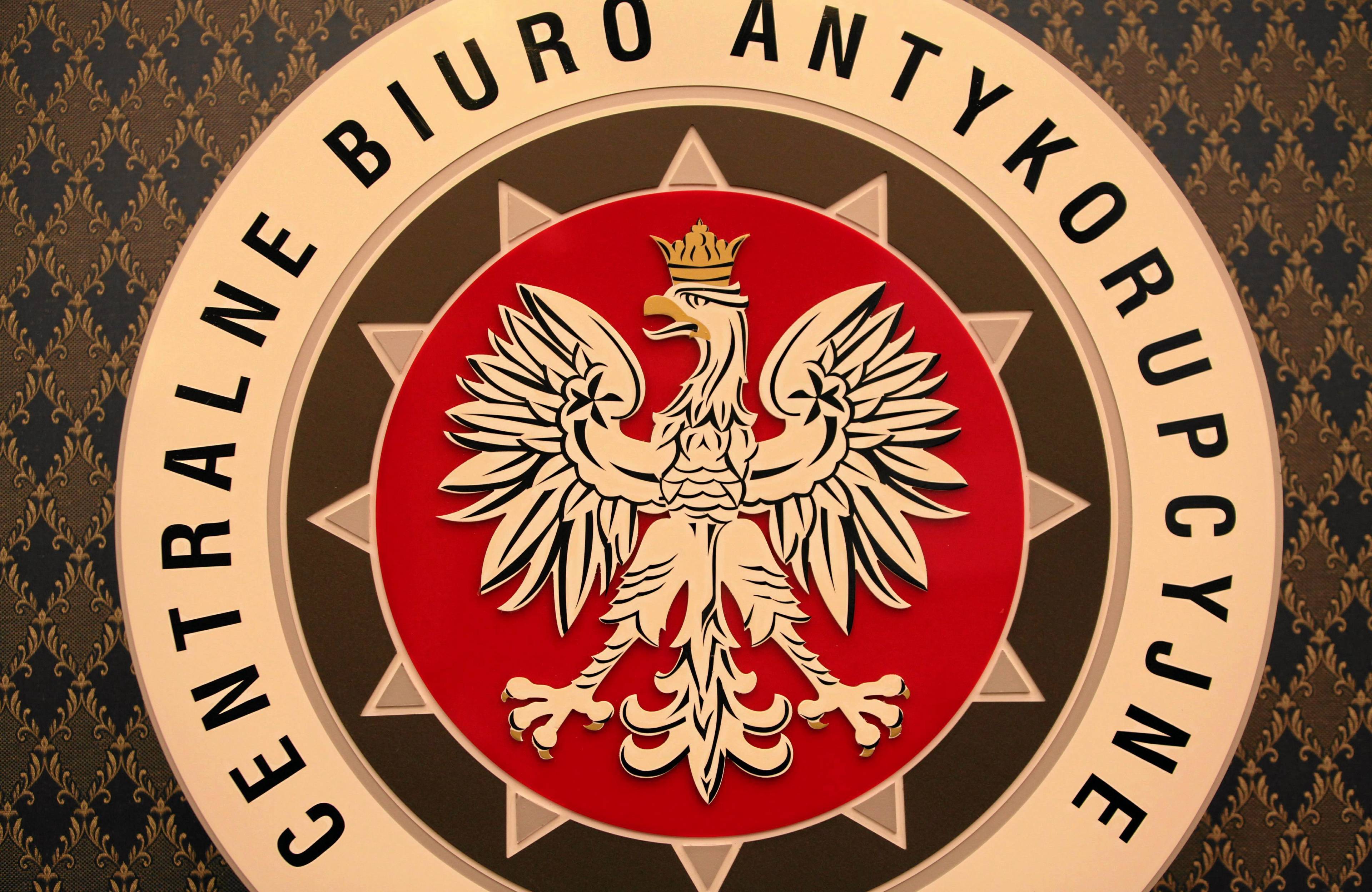 logo cba, z białym orłem w centrum