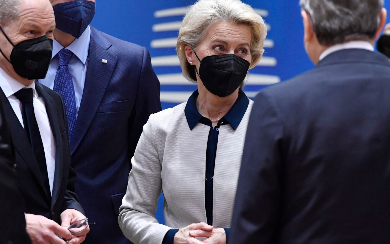 (FRom L) Lithuania's President Gitanas Nauseda, German Chancellor Olaf Scholz, Greek Prime Minister Kyriakos Mitsotakis, European Commission President Ursula von der Leyen, Italys Prime Minister Mario Draghi and Denmarks Prime Minister Mette Frederiksen talk during an emergency European Union (EU) summit at The European Council Building in Brussels on February 24, 2022, on the situation in Ukraine after Russia launched an invasion. - Russian President Vladimir Putin launched a full-scale invasion of Ukraine on February 24, killing dozens and forcing hundreds to flee for their lives in the pro-Western neighbour. Russian air strikes hit military facilities across the country and ground forces moved in from the north, south and east, triggering condemnation from Western leaders and warnings of massive sanctions. (Photo by Geert Vanden Wijngaert / POOL / AFP)