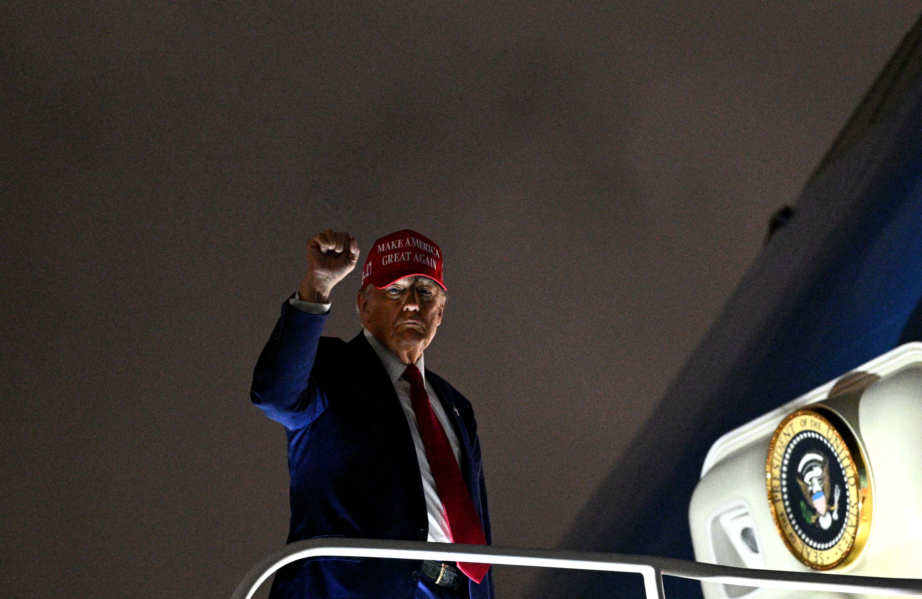 US President Donald Trump steps off Air Force One arrives at Miami International Airport