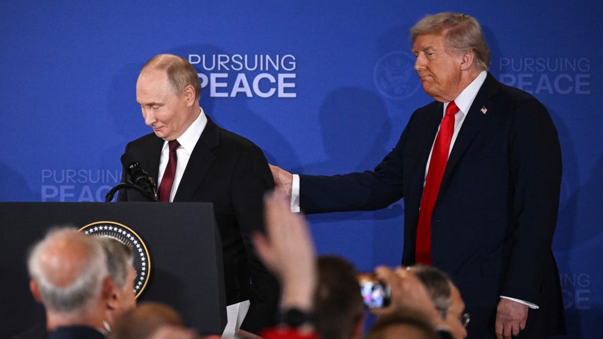 US President Donald Trump (R) and Russian President Vladimir Putin walk away after delivering a joint press conference after participating in a US-Russia summit on Ukraine at Joint Base Elmendorf-Richardson in Anchorage, Alaska, on August 15, 2025. (Photo by Drew ANGERER / AFP)