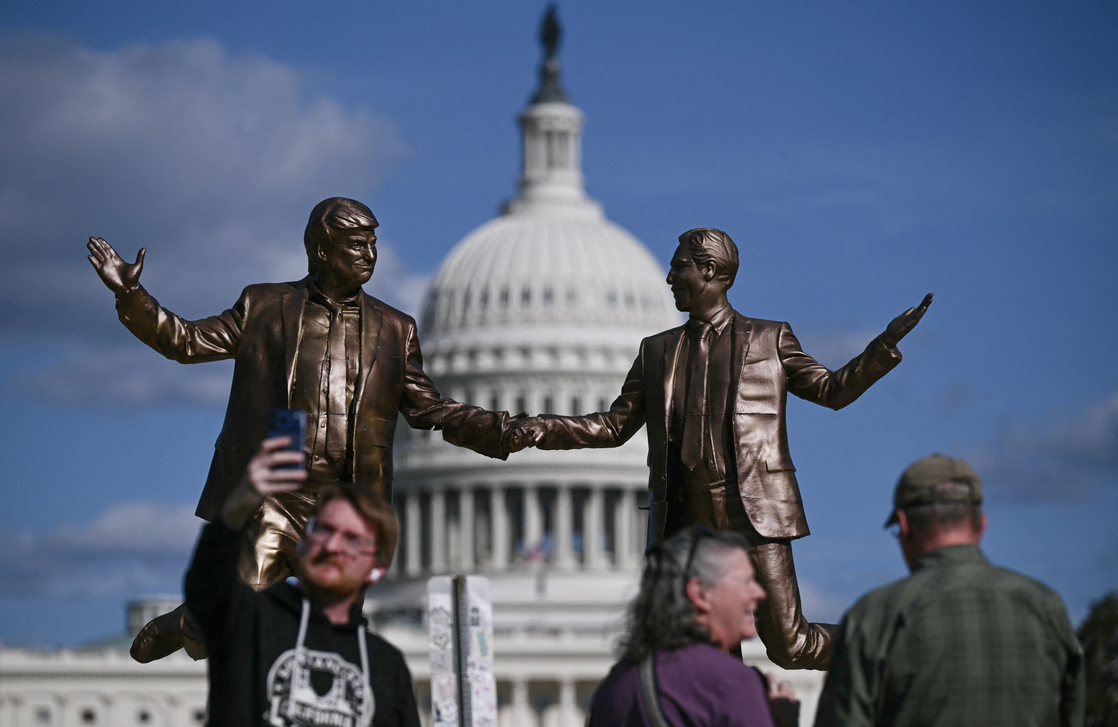 A statue of US President Donald Trump and Jeffrey Epstein holding hands returns near the US Capitol in Washington, DC.