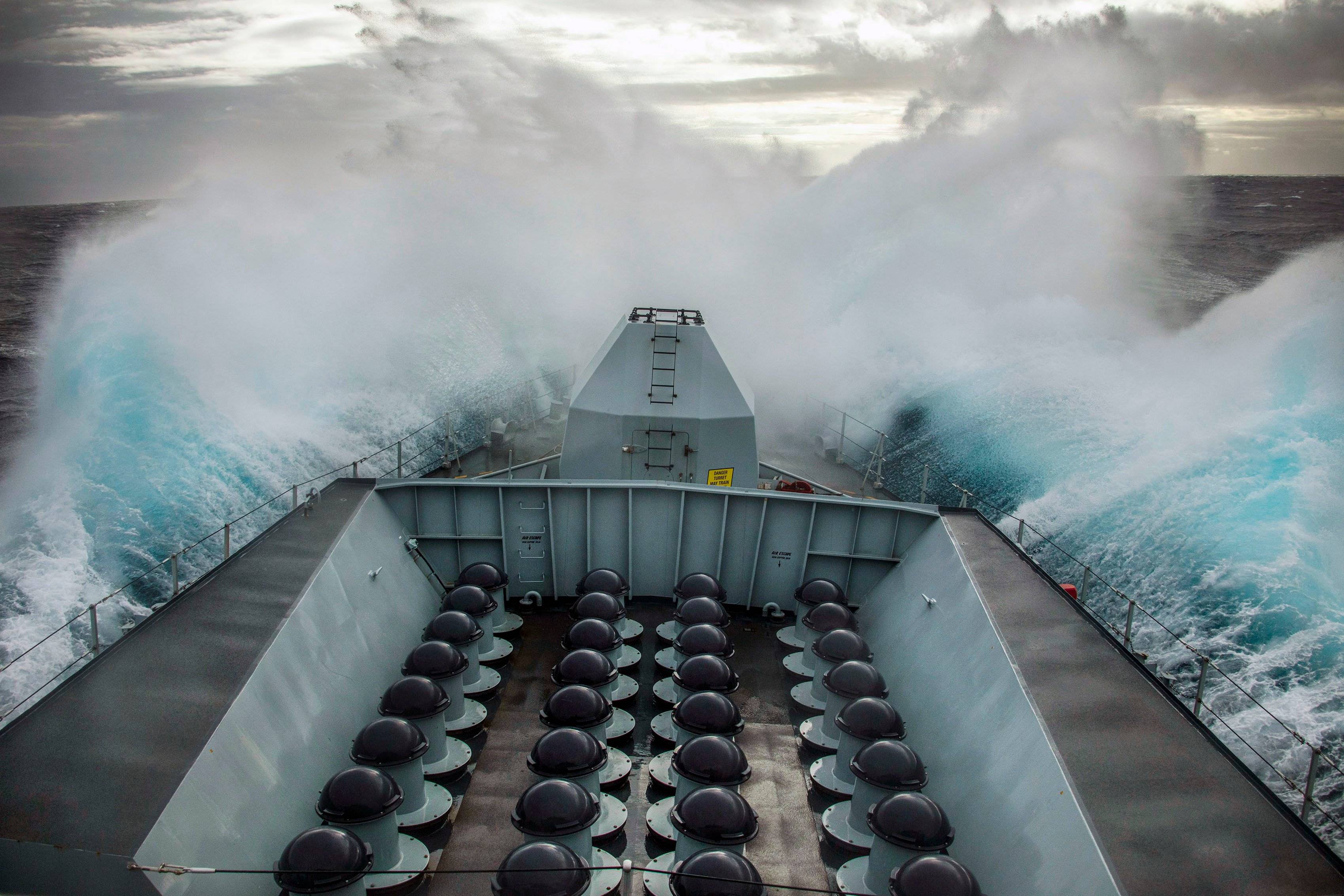 Pictured, Waves crash over HMS Lancaster's bow as she transits along Norway's coastline.

On 26th March 2021, HMS Lancaster started her transit south from Norway having been exercising with the Norwegian Frigate  THNoMS Thor Heyerdahl.

During the transit south down the the Norwegian coastline she encountered high seas which made for some impressive wave formations crashing over her bow.

The Type 23 Frigate from HMNB Portsmouth will conduct a short stint of maritime security patrols around the UK coastline before taking over duties as the Fleet Ready Escort Ship.

All the ships in the Type 23 class are named after Dukes, in this case, the Duke of Lancaster.

HMS Lancaster recently had a major refit and some of her new equipment includes a new Artisan 3D radar and vastly-improved air-defence capabilities provided by Sea Ceptor, replacing Sea Wolf missiles which only possess about half the Sea Ceptors range.

The hull was cleaned and coated with anti-fouling paint to prevent marine life attaching itself, the main 4.5in gun serviced, engines and machinery overhauled, new systems installed, and the bridge, messes and other communal areas revamped.