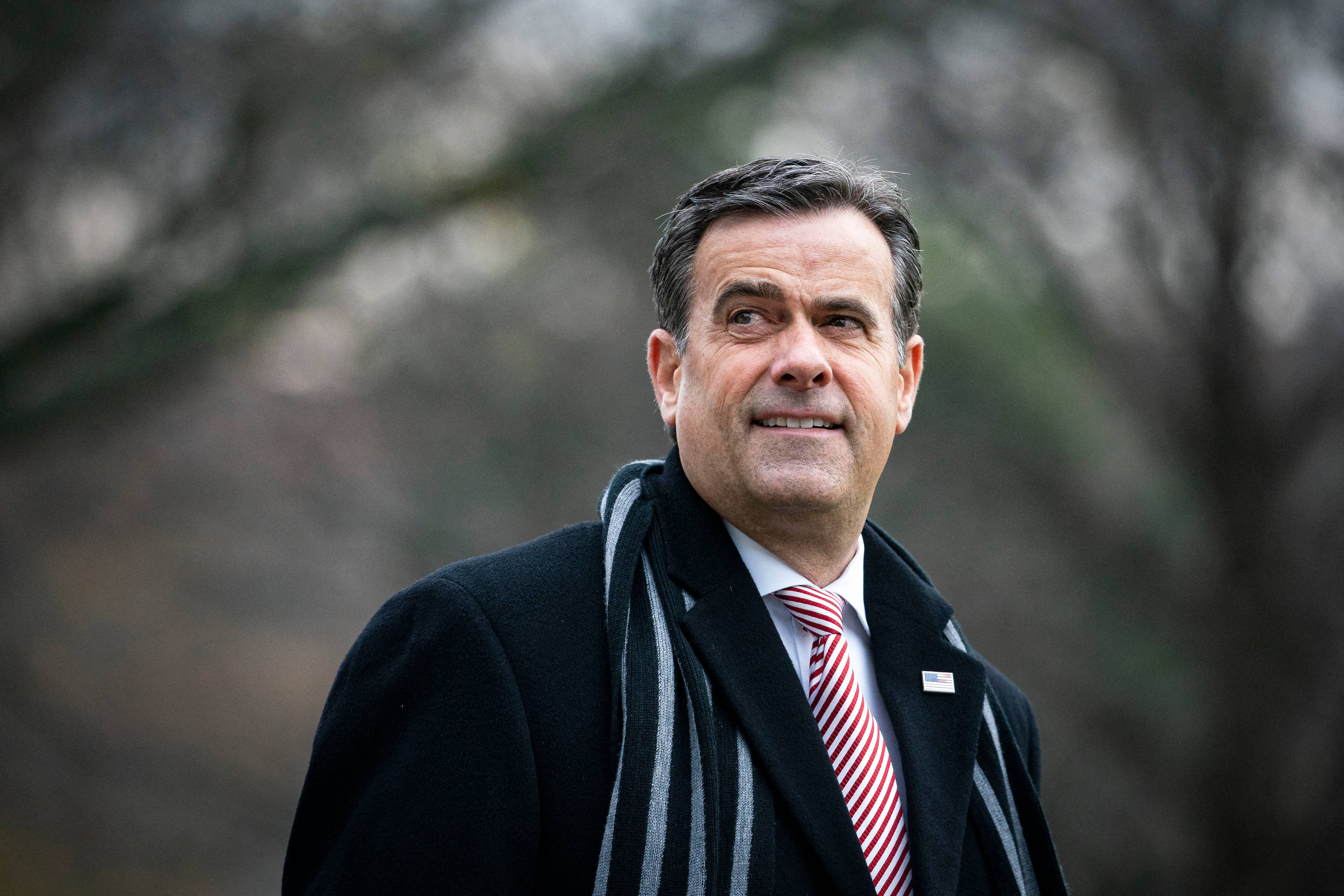 WASHINGTON, DC - DECEMBER 12: Director of National Intelligence John Ratcliffe follows behind U.S. President Donald Trump, as they depart on the South Lawn of the White House, on December 12, 2020 in Washington, DC. Trump is traveling to the Army versus Navy Football Game at the United States Military Academy in West Point, NY.   Al Drago/Getty Images/AFP (Photo by Al Drago / GETTY IMAGES NORTH AMERICA / Getty Images via AFP)