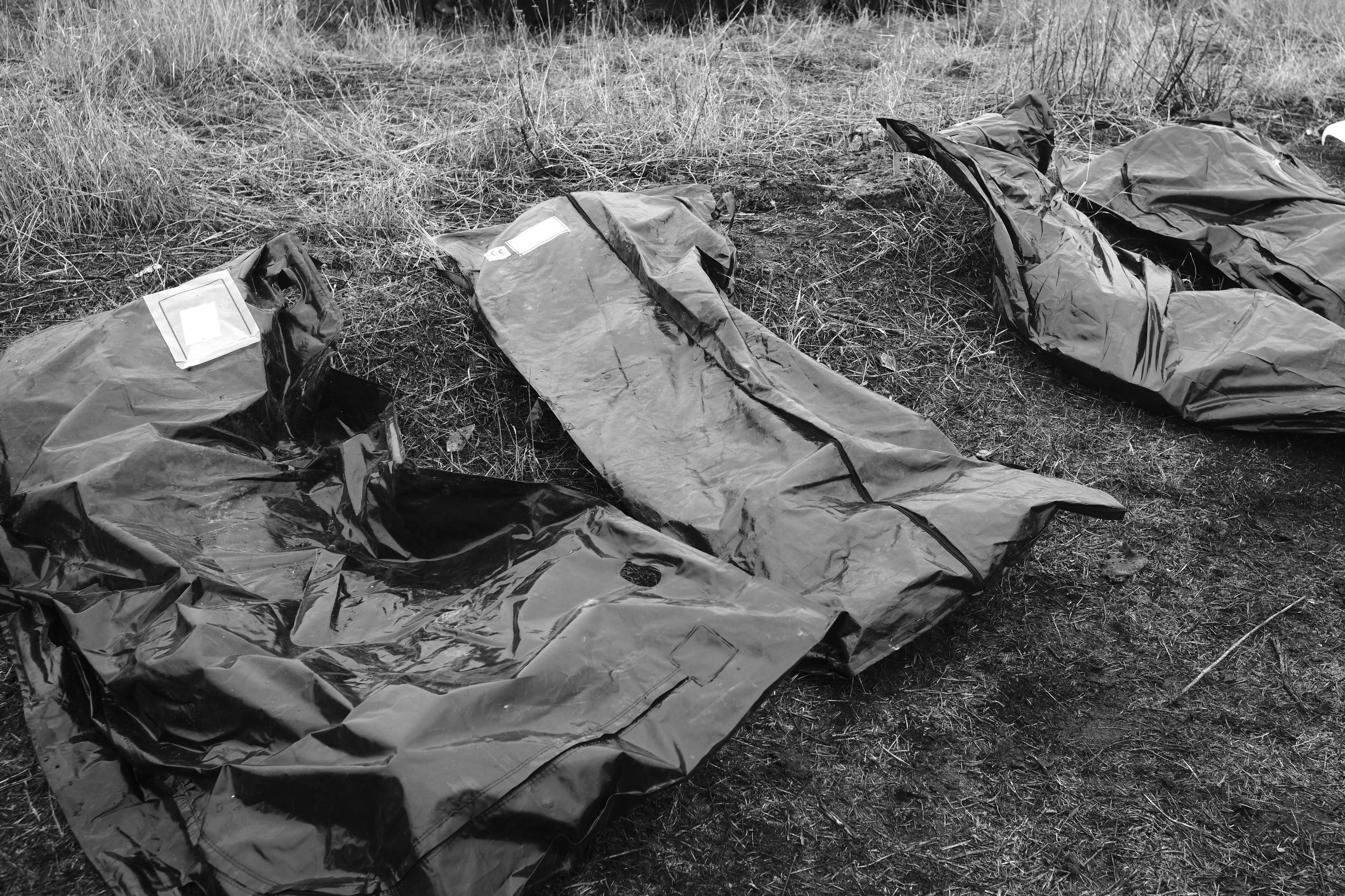 Members of the Black Tulips unit identify the bodies of fallen Russian soldiers in Donbas