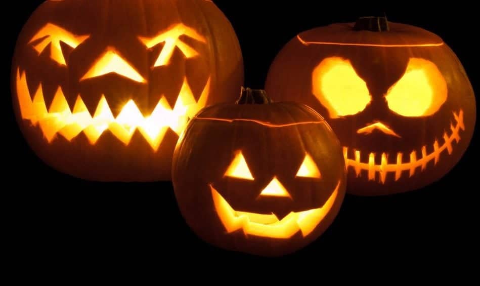 Jack-o'-lanterns carved from pumpkins and lit with tea lights