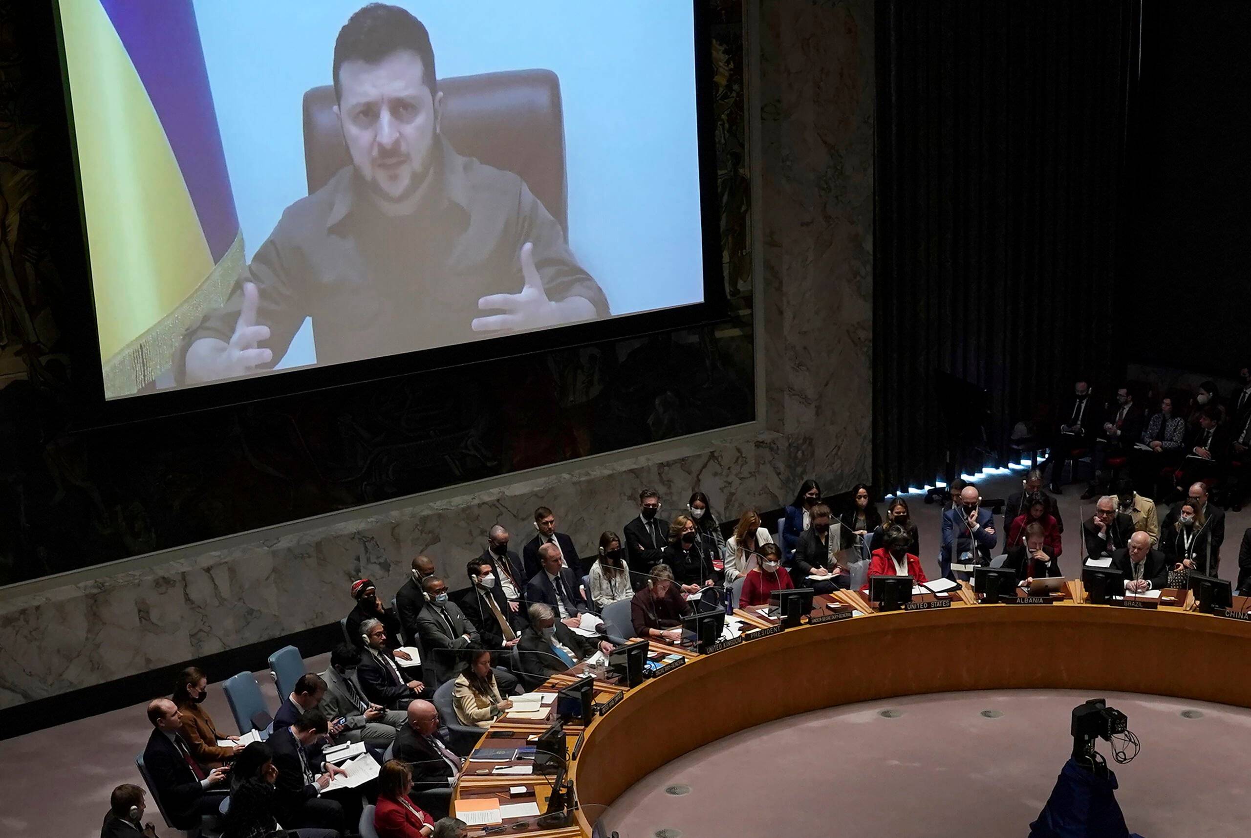 President Volodymyr Zelensky, of Ukraine, addresses a meeting of the United Nations Security Council in New York City on April 5, 2022. - Zelensky challenged the United Nations to "act immediately" or "dissolve yourself altogether" during a blistering address in which he showed a harrowing video of dead bodies -- including children -- he said were victims of Russian atrocities. (Photo by TIMOTHY A. CLARY / AFP)