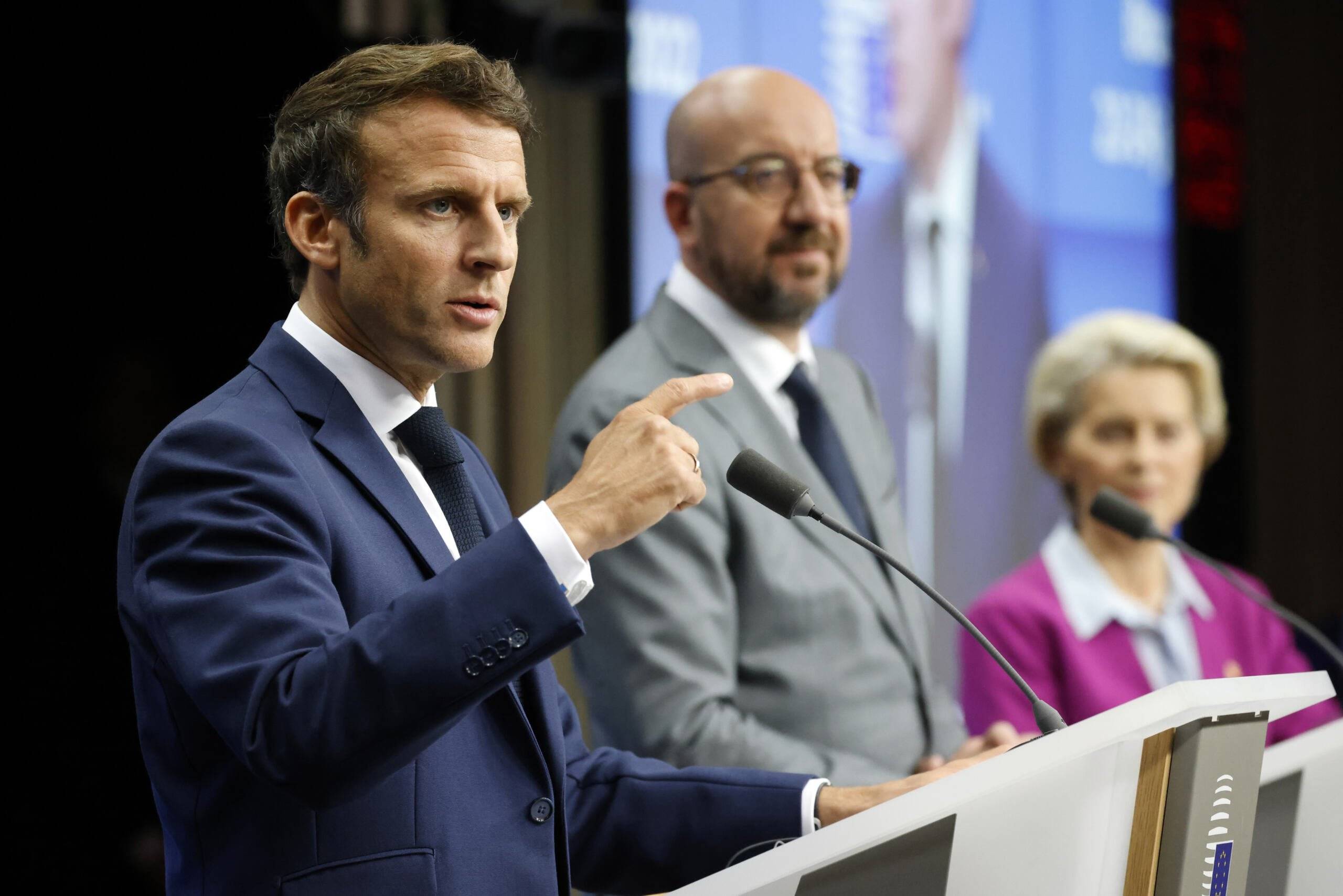 France's President Emmanuel Macron (L) gives a press conference with President of the European Council Charles Michel (C) and President of the European Commission Ursula von der Leyen at The European Council Building in Brussels on June 24, 2022. (Photo by Ludovic MARIN / AFP)