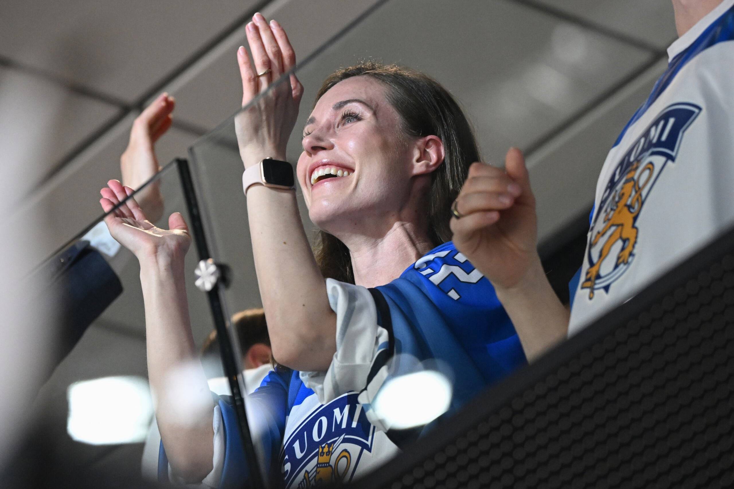 Finnish Prime Minister Sanna Marin celebrates a goal during the IIHF Ice Hockey World Championships final match between Finland and Canada in Tampere, Finland, on May 29, 2022. (Photo by Jonathan NACKSTRAND / AFP)