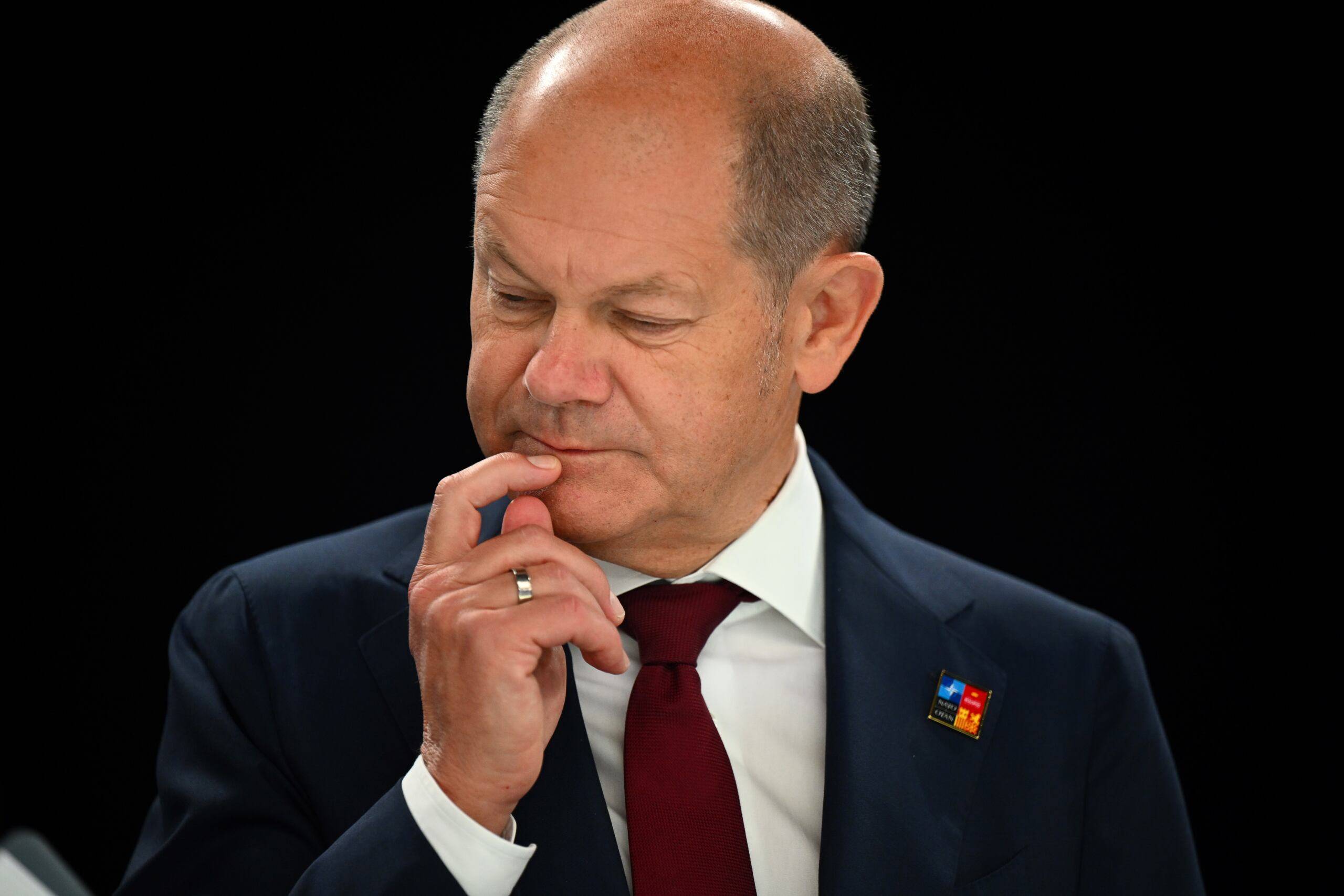 German Chancellor Olaf Scholz gestures ahead of a meeting of The North Atlantic Council during the NATO summit at the Ifema congress centre in Madrid, on June 30, 2022. (Photo by GABRIEL BOUYS / AFP)