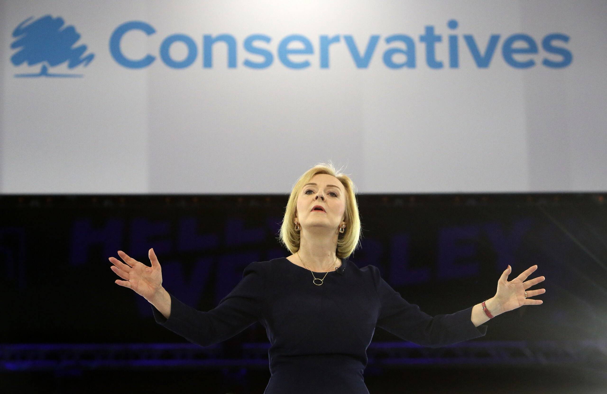 (FILES) In this file photo taken on August 31, 2022 Liz Truss, Britain's Foreign Secretary and a contender to become the country's next Prime Minister and leader of the Conservative party, answers questions as she takes part in a Conservative Party Hustings event at Wembley Arena, in London. - The UK will learn on September 5, 2022 who will be its next prime minister, with foreign minister Liz Truss expected to be announced winner of a lengthy vote by Conservative Party members. The result will be announced at 12.30 pm (1130 GMT), after foreign minister Truss and her rival, former finance minister Rishi Sunak, spent the summer campaigning. (Photo by Susannah Ireland / AFP)