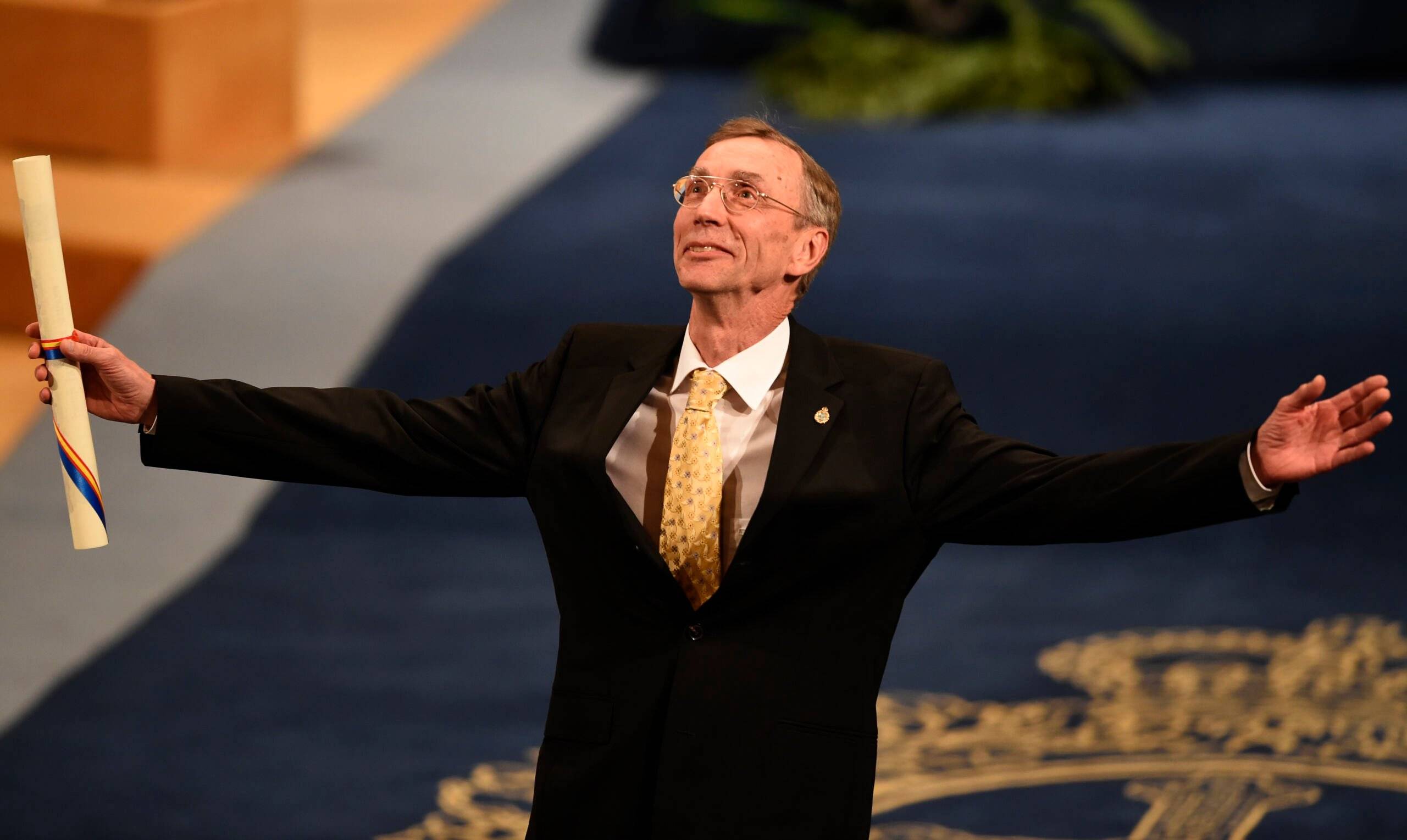 (FILES) In this file photo taken on October 19, 2018 Swedish biologist Svante Paabo celebrates on the stage after receiving the 2018 Princess of Asturias Award for Technical and Scientific Research during the Princess of Asturias Awards ceremony at the Campoamor Theatre in Oviedo, on October 19, 2018. - Swedish paleogeneticist Svante Paabo, who sequenced the genome of the Neanderthal and discovered the previously unknown hominin Denisova, on October 3, 2022 won the Nobel Medicine Prize. (Photo by MIGUEL RIOPA / AFP)