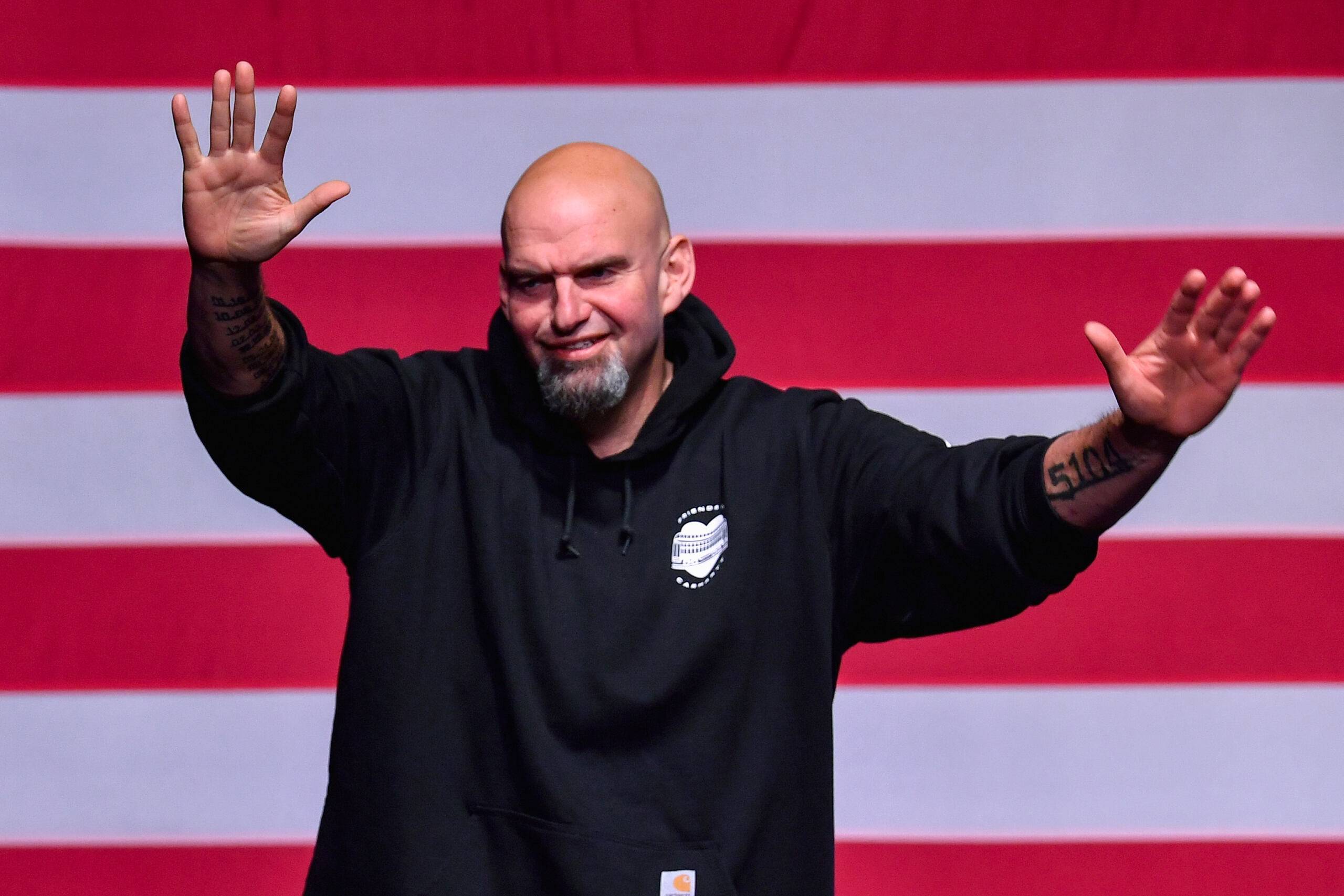Pennsylvania Democratic Senatorial candidate John Fetterman waves onstage at a watch party during the midterm elections at Stage AE in Pittsburgh, Pennsylvania, on November 8, 2022. - President Joe Biden's party picked up a first seat in the upper chamber of Congress on Tuesday as Democrat John Fetterman defeated celebrity doctor Mehmet Oz in Pennsylvania, media projections showed. (Photo by ANGELA WEISS / AFP)