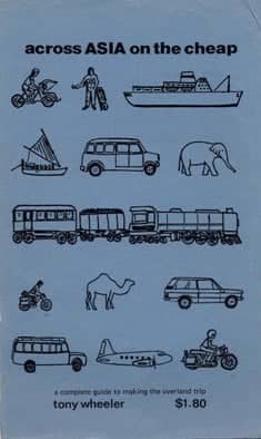 Szaroniebieska okładka przewodnika po Azji wydawnictwa "Lonely planet". Na okładce grafika słonia, wielbłąda, samochodu, pociągu, łodzi inne