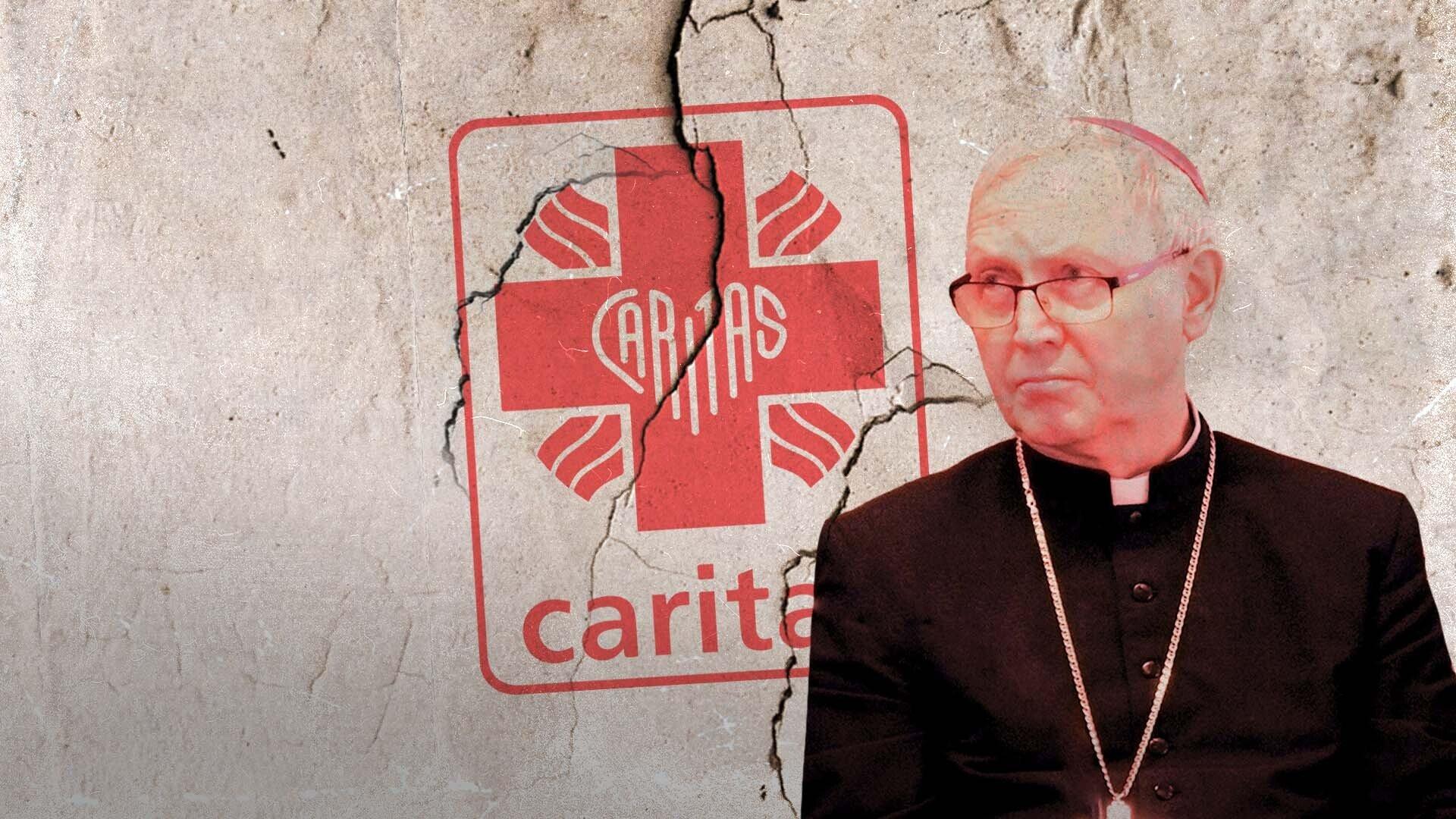 Biskup płocki Piotr Libera na tle popękanego logo Caritas.