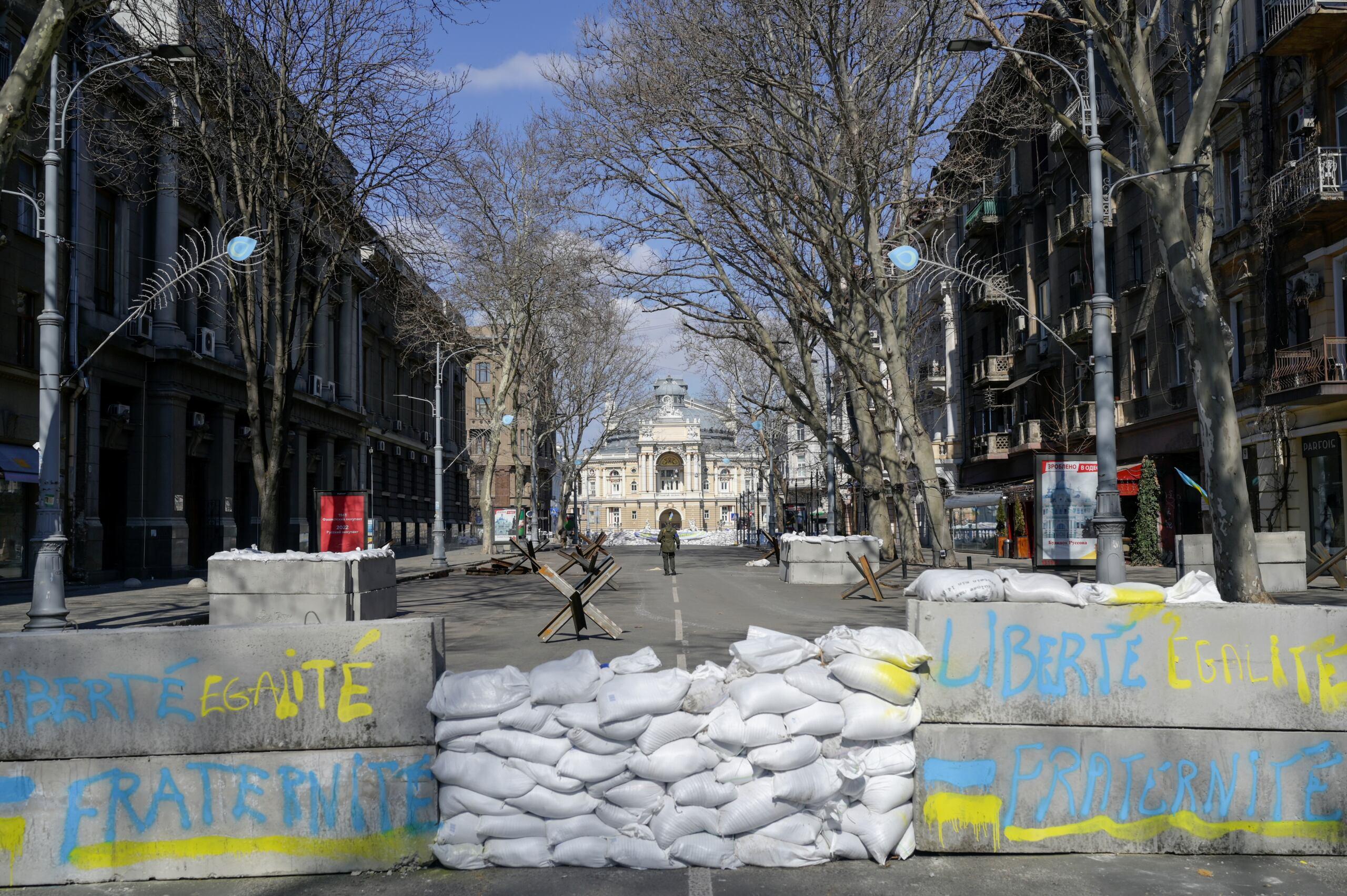 Concrete blocks with French national motto "liberty, equality, fraternity" written on it 
form a barricade in front of the National Academic Theater of Opera and Ballet in Odessa on March 17, 2022. - Odessa, which Ukraine fears could be the next target of Russia's offensive in the south, is the country's main port and is vital for its economy. But the city of one million people close to the Romanian and Moldovan borders also holds a special place in the Russian imagination. (Photo by BULENT KILIC / AFP)