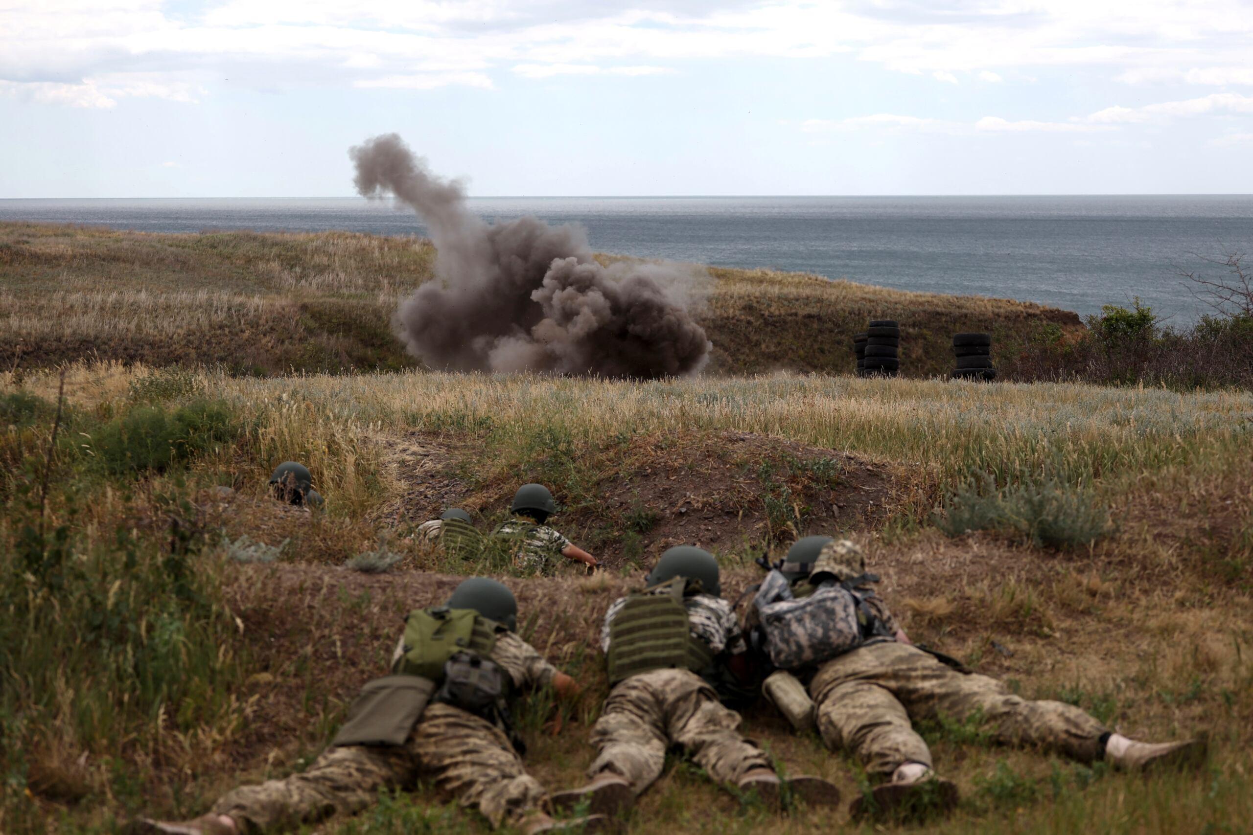 Servicemen of the 126th Separate Territorial Brigade of the Armed Forces of Ukraine take part in military exercises in Odessa region on June 22, 2022, amid Russia's military invasion launched on Ukraine. (Photo by Oleksandr GIMANOV / AFP)